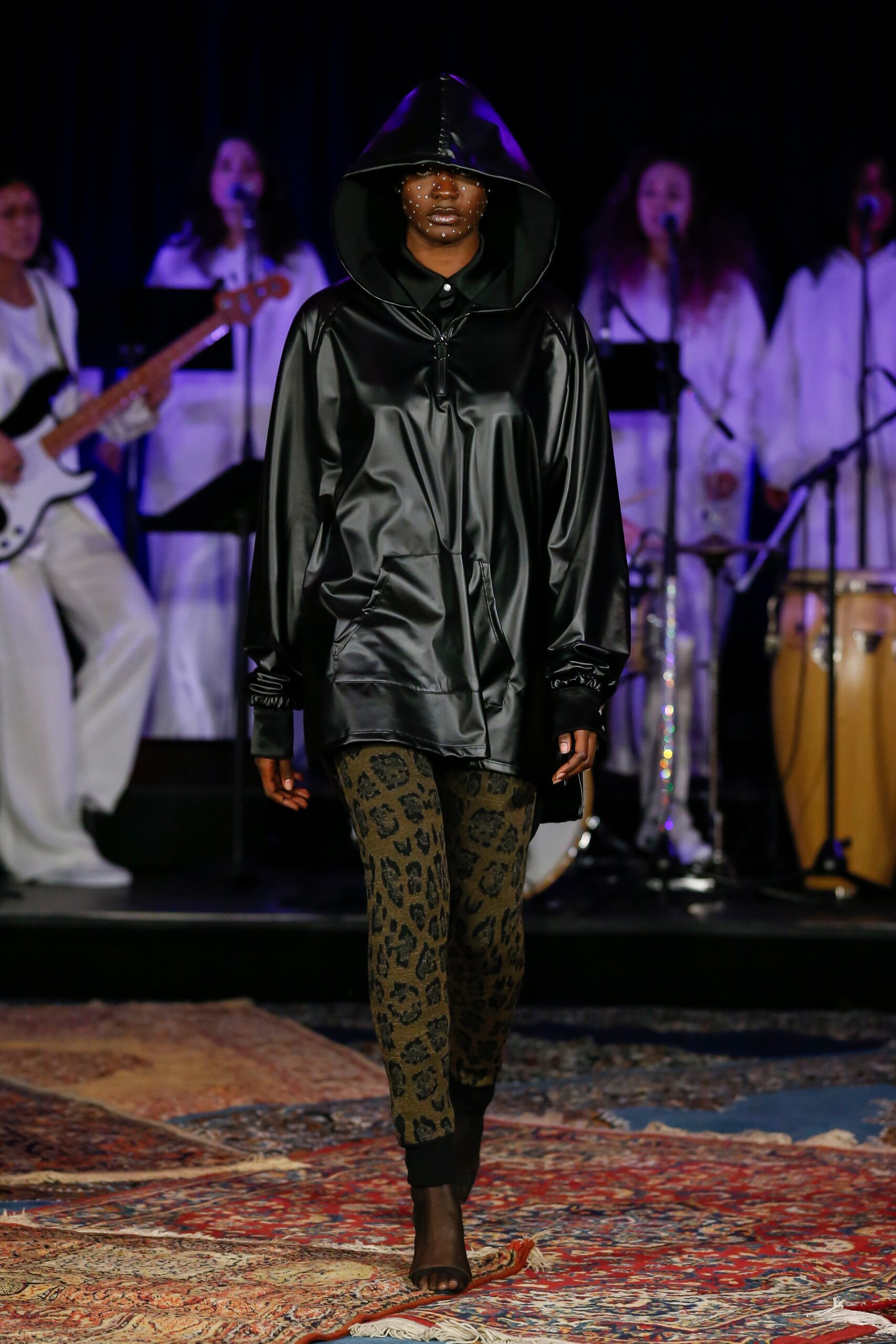 black vinyl hoodie with animal-print pants