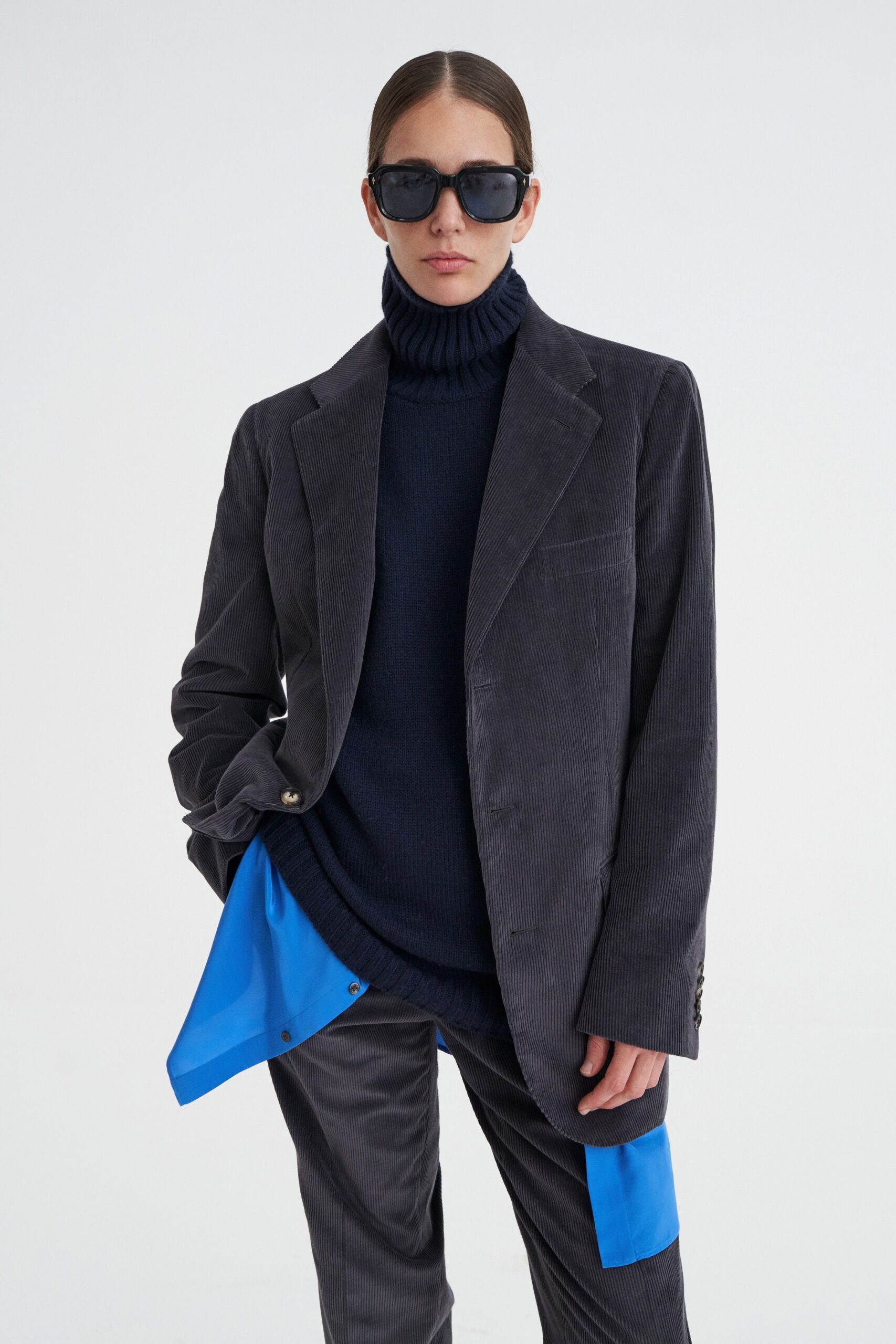 gray tailored blazer with navy sweater
