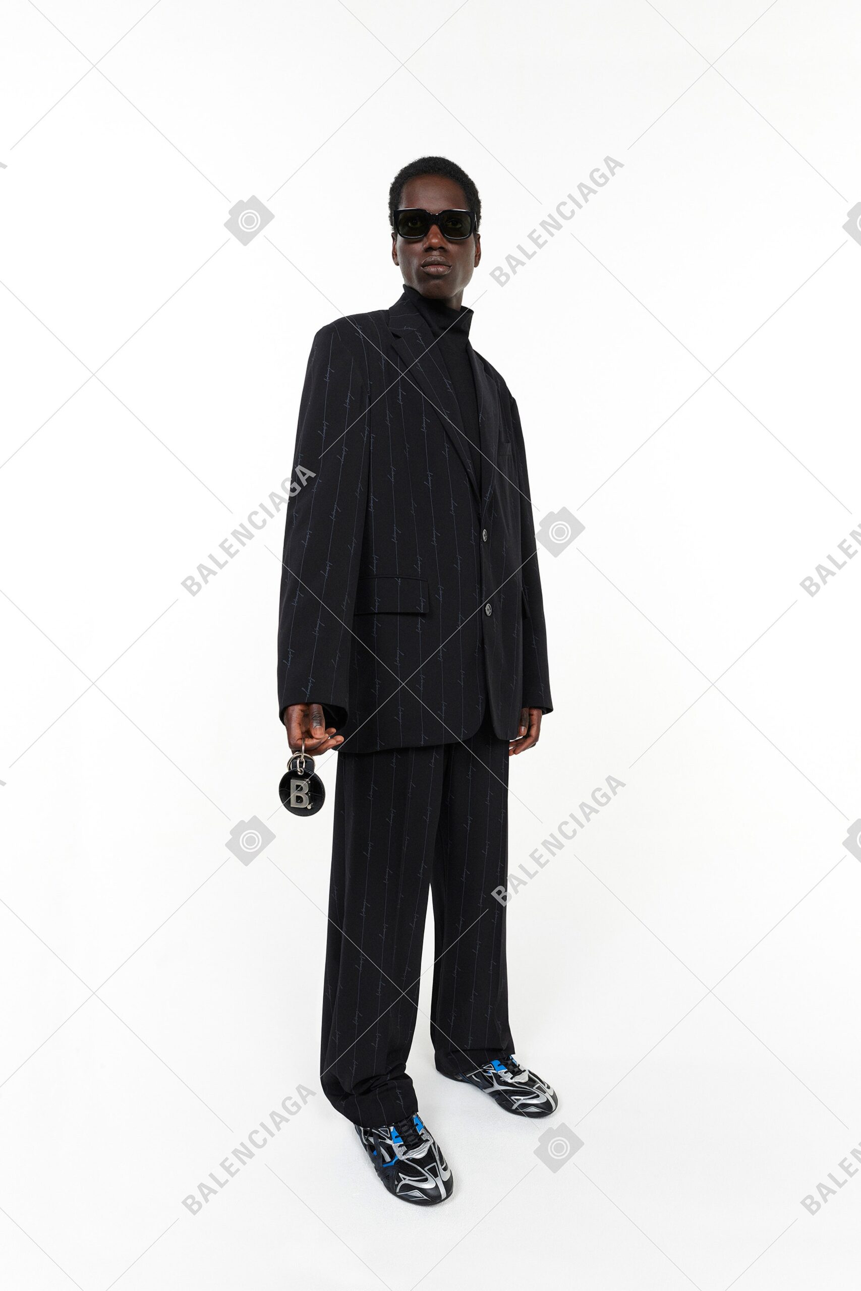 black tailored suit with sunglasses