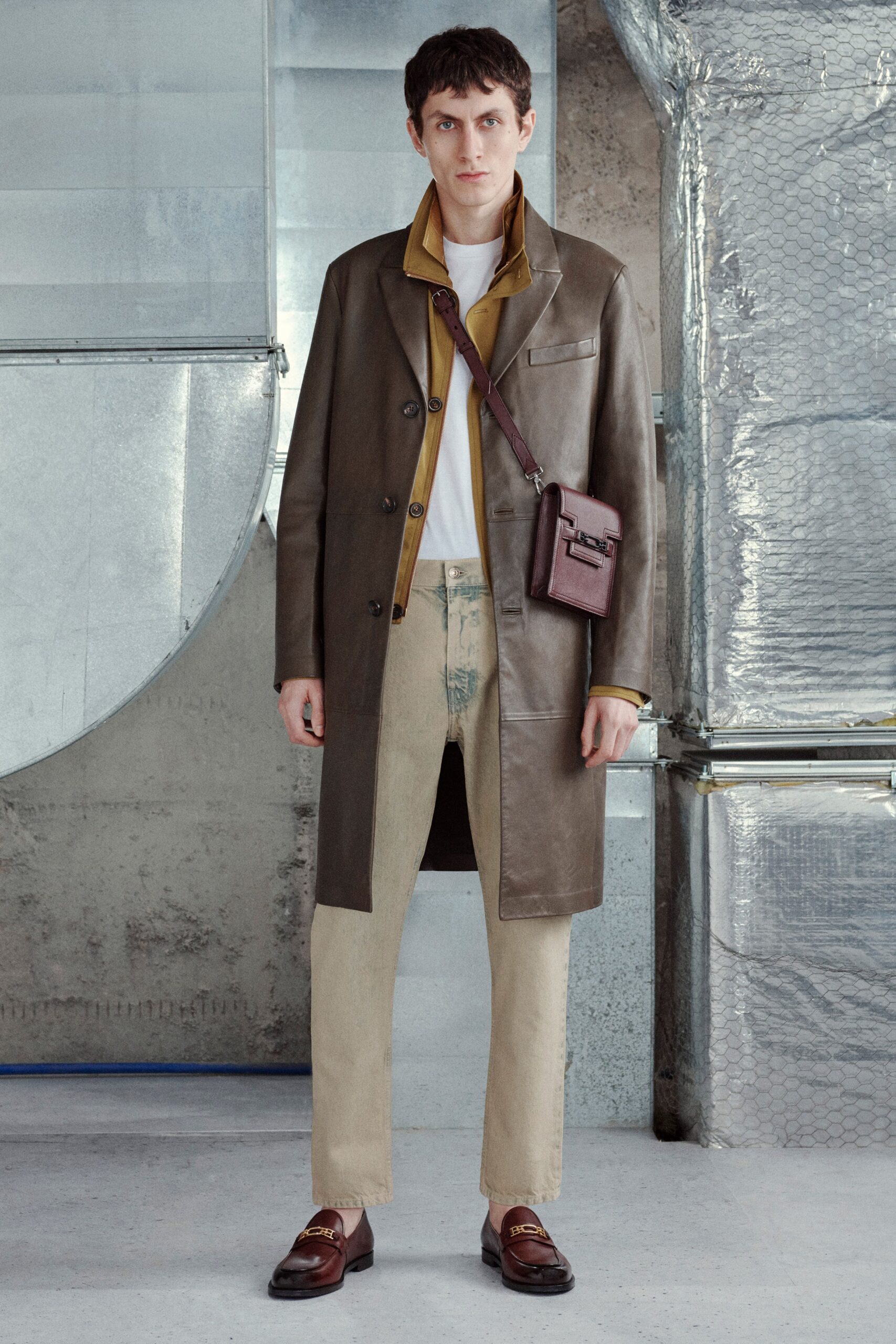 brown leather coat with beige pants