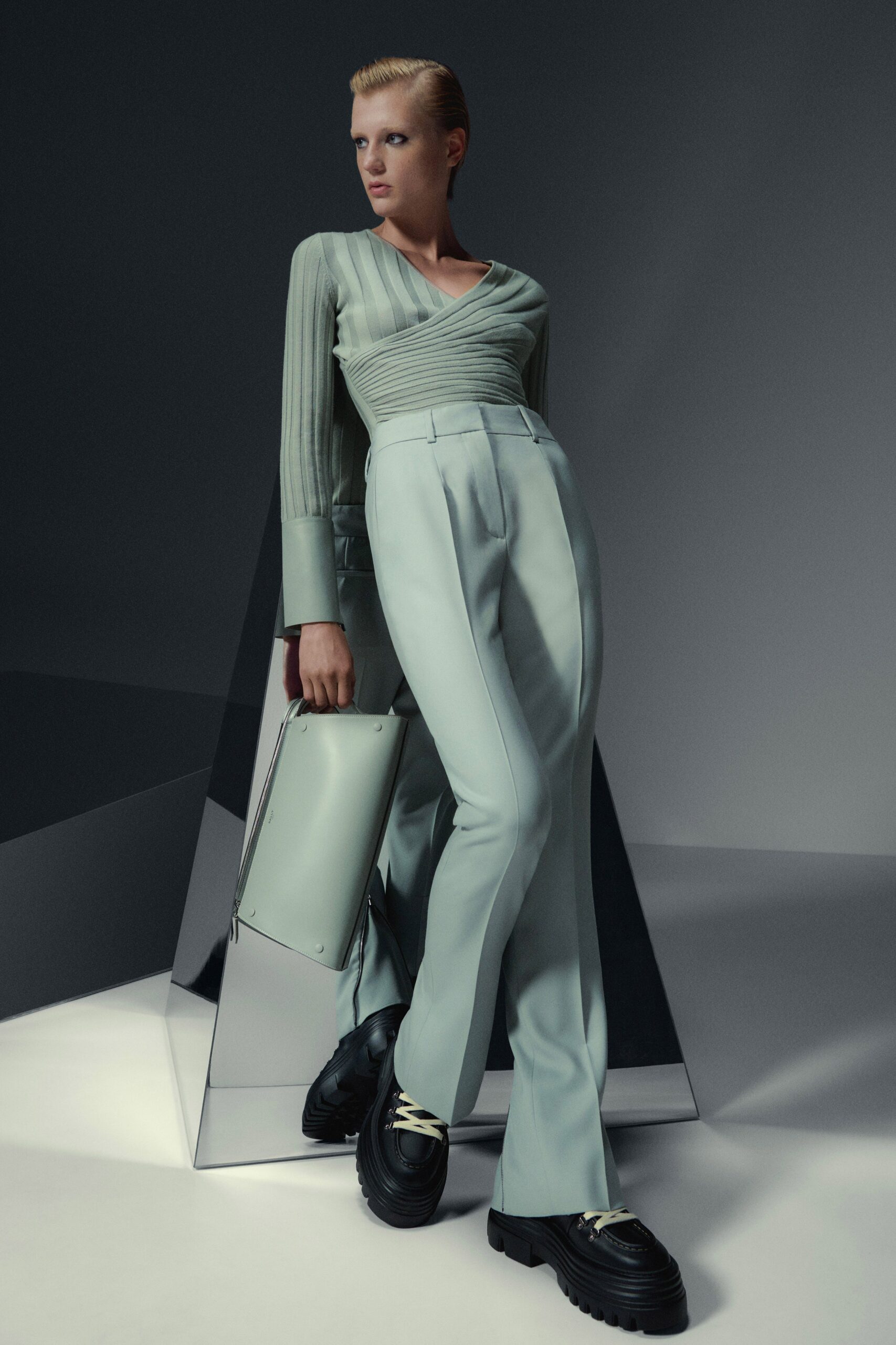 fitted green top with tailored pants