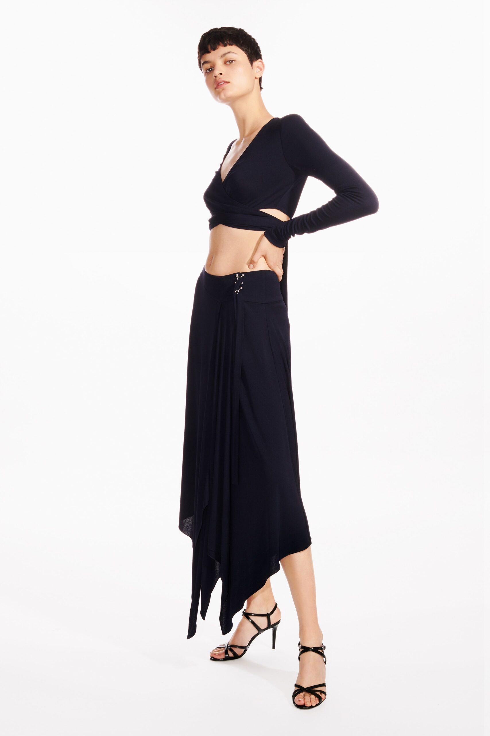 black fitted top and asymmetric skirt