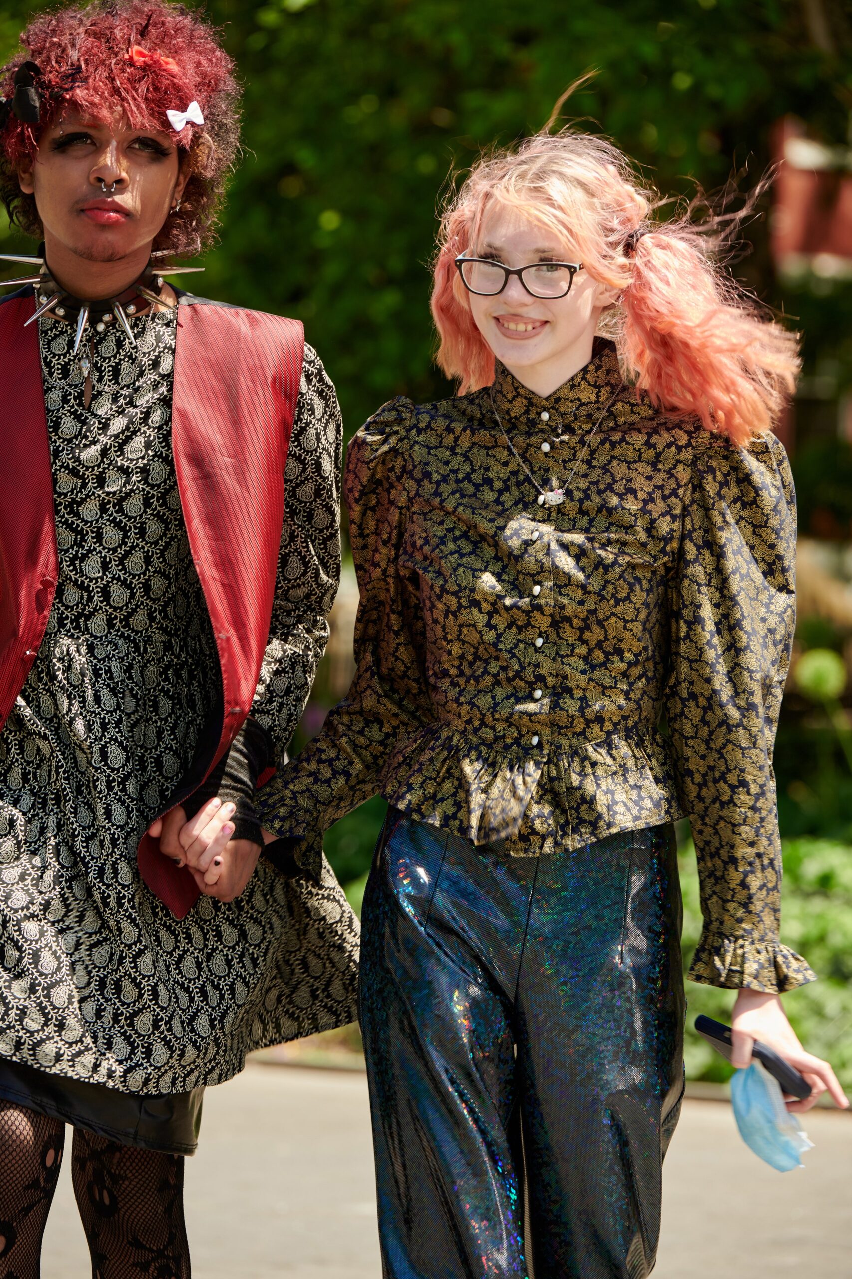 fitted black and gold blouse with vinyl pants