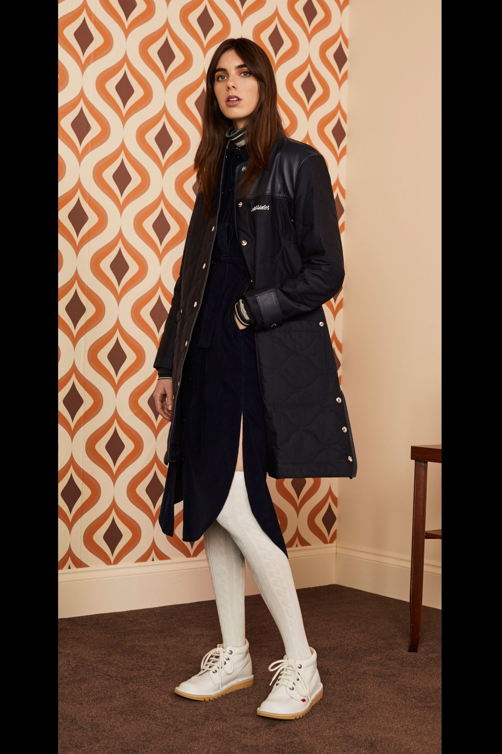 black coat navy dress white shoes