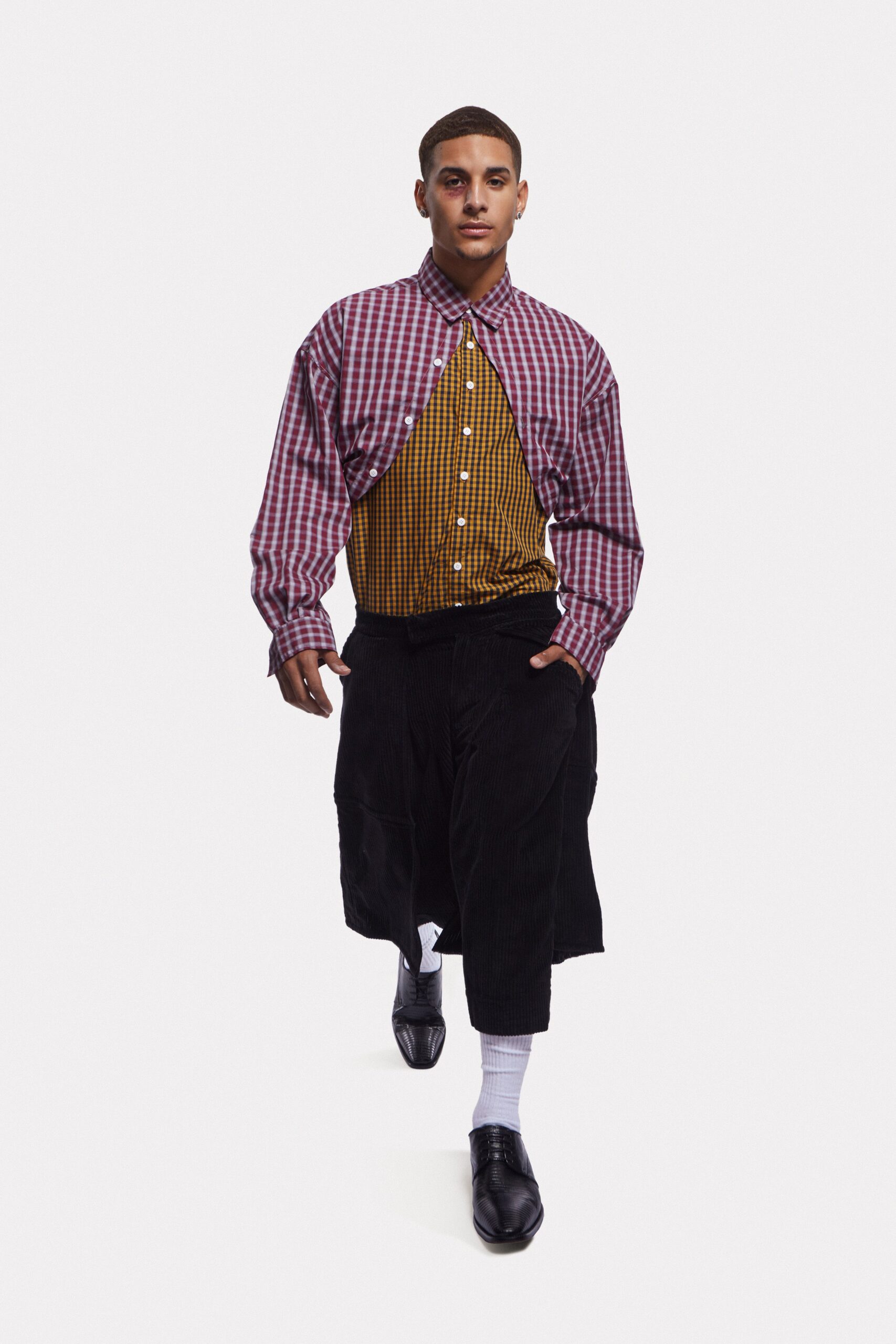 checked shirt and black pants