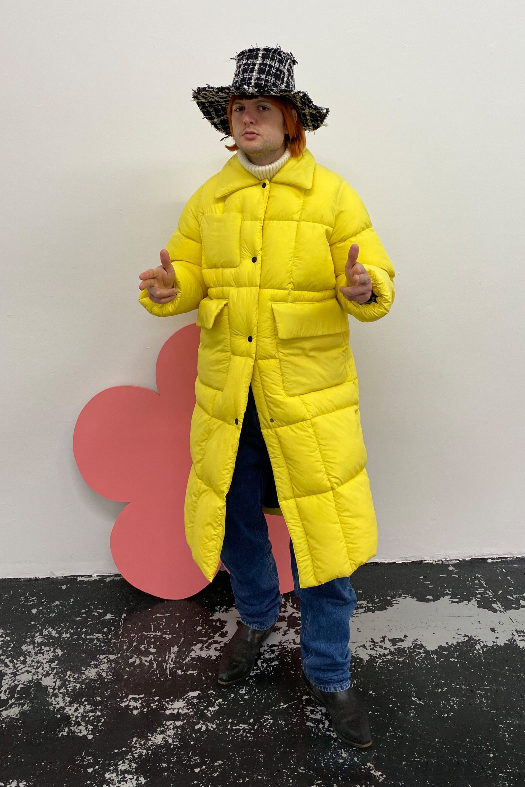 yellow padded coat with jeans