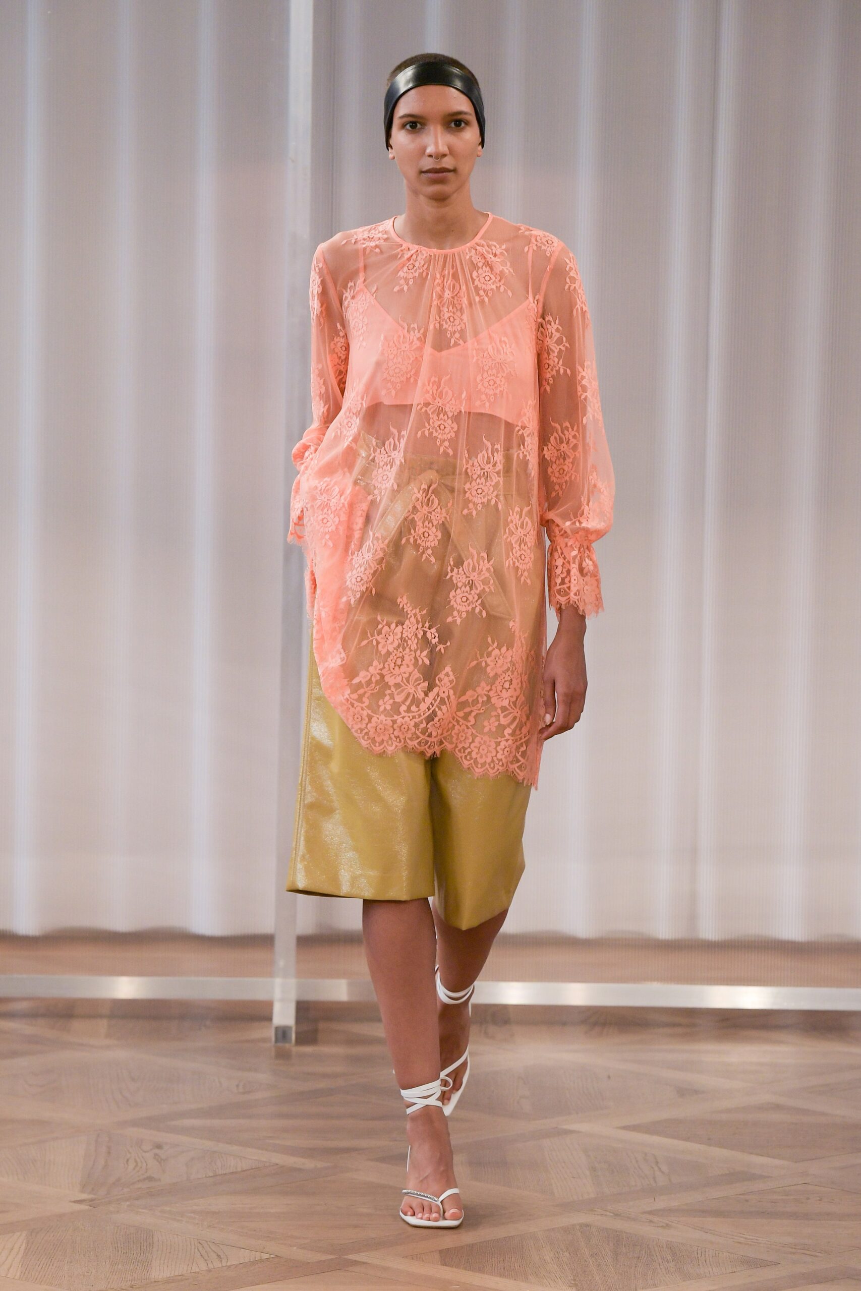 pink chiffon top with gold shorts