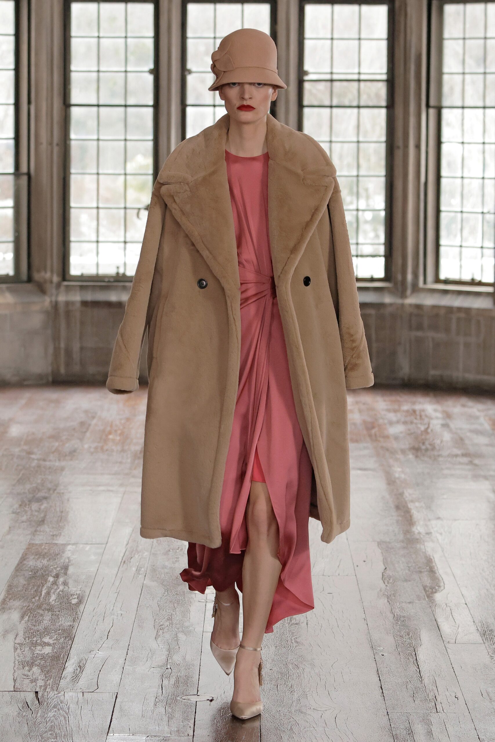 beige faux-fur coat with pink dress