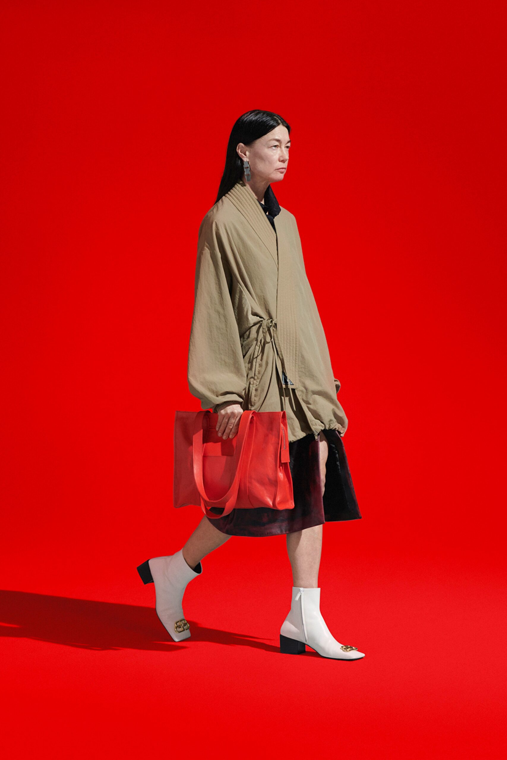 beige coat black skirt white shoes