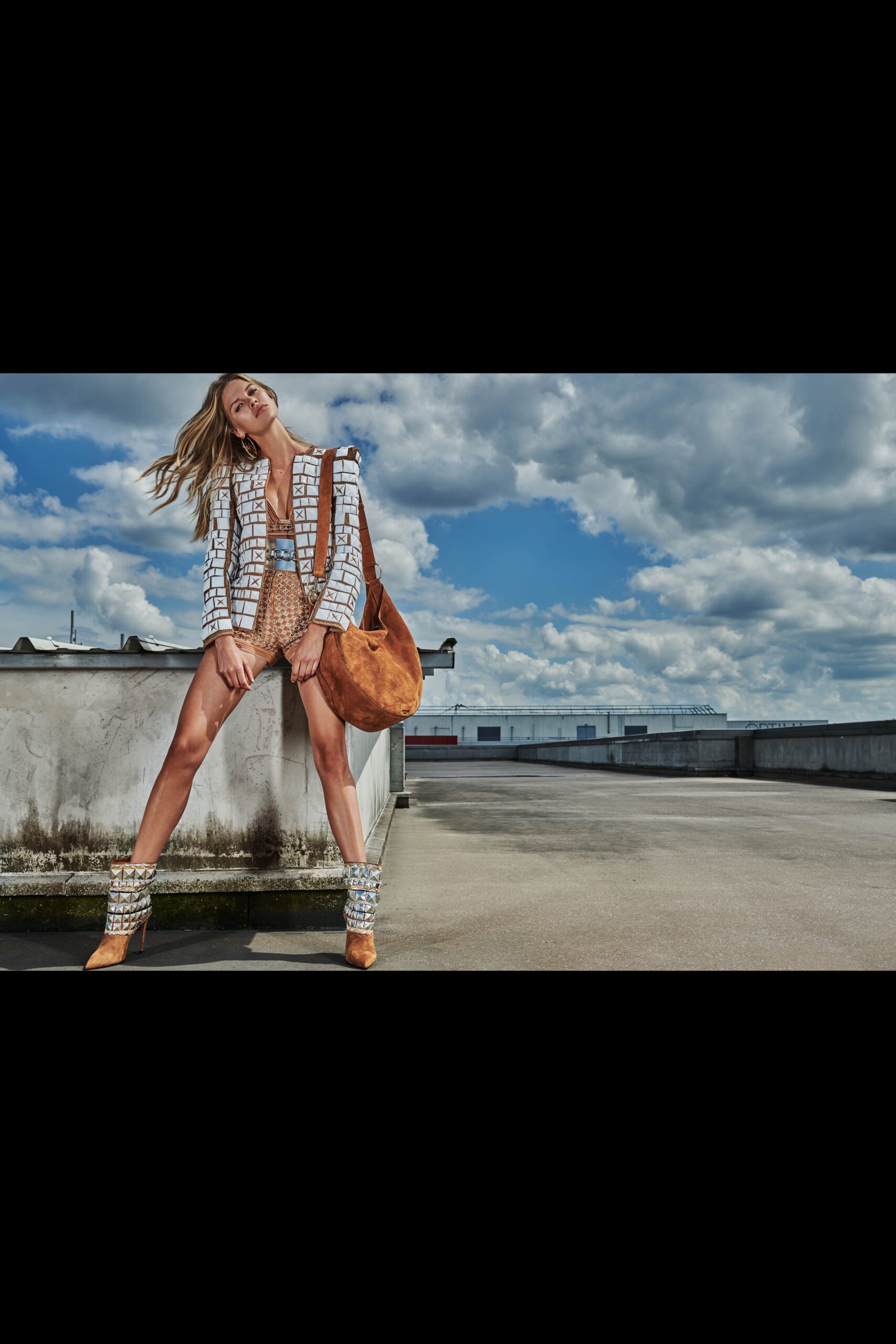 fitted white jacket with brown shorts