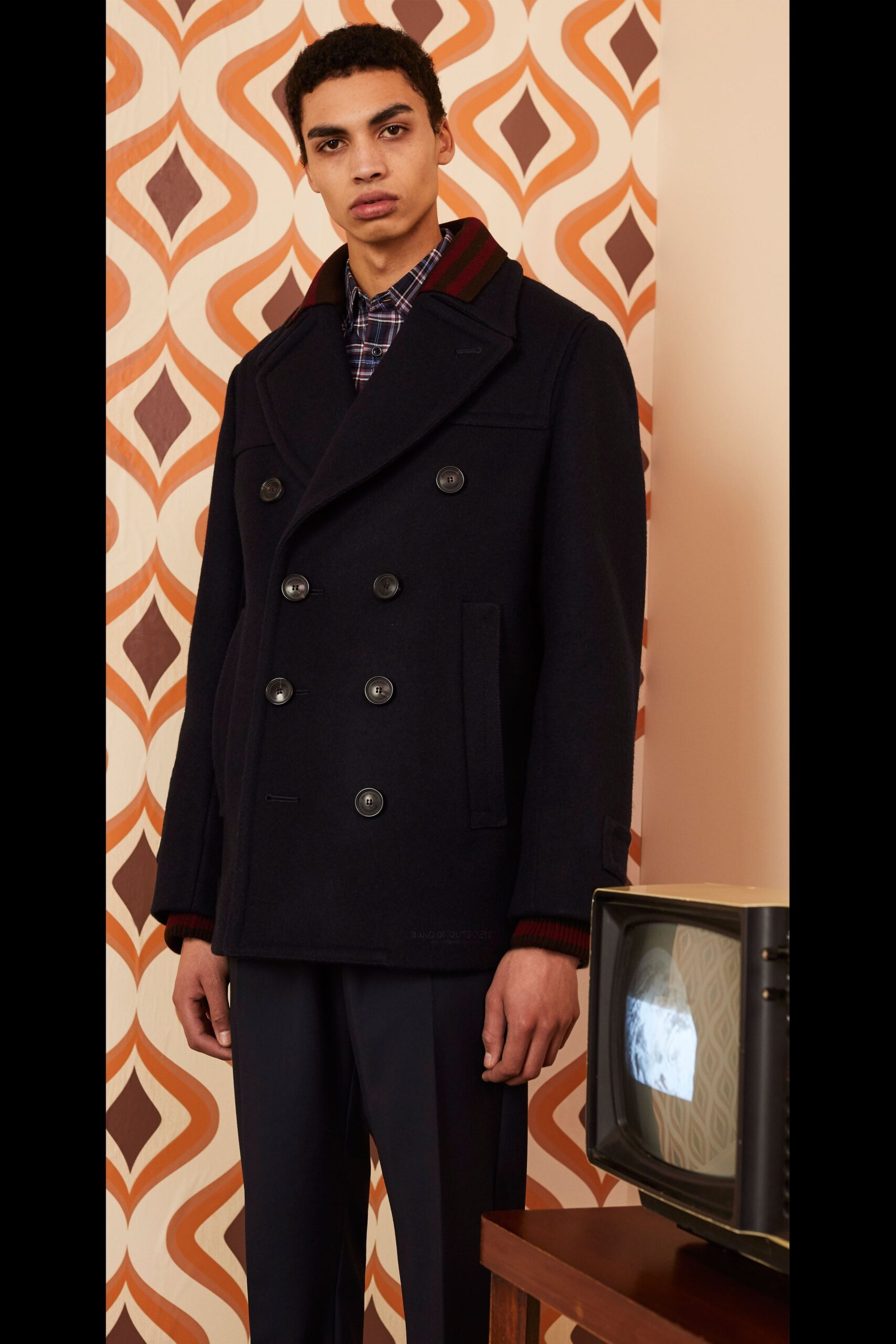 black wool long-sleeve collared structured buttoned jacket