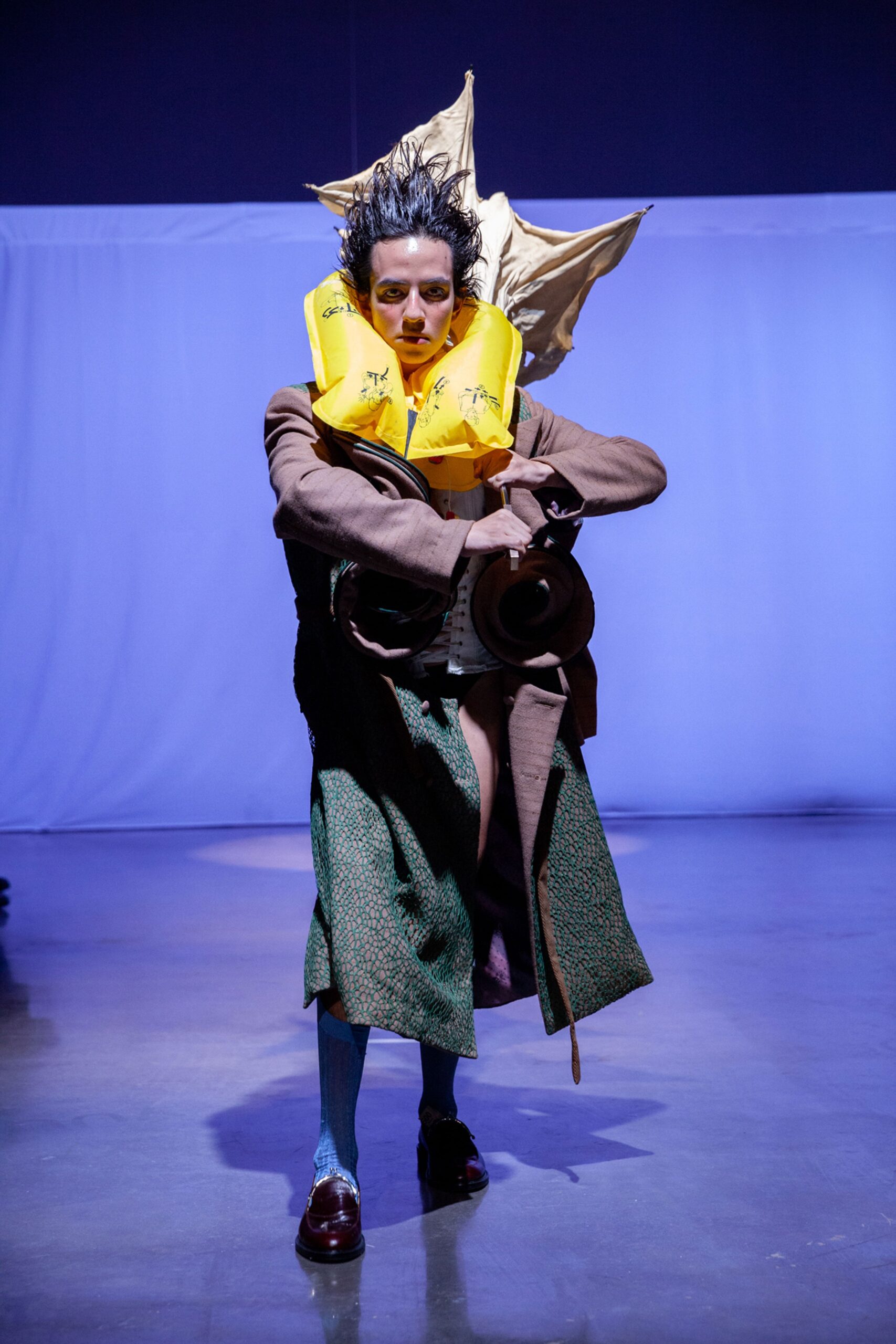 green wool relaxed coat with black mini dress