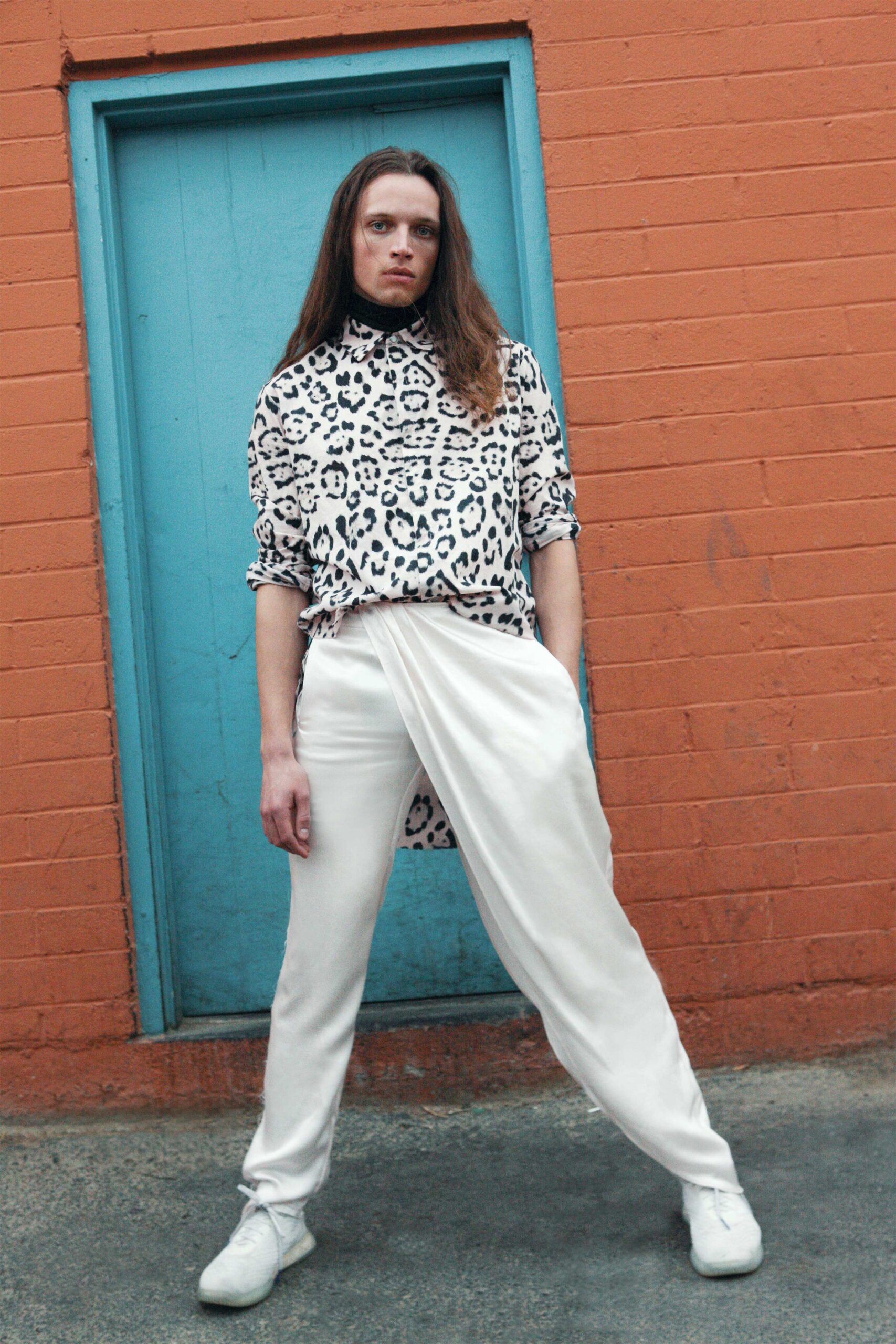 animal-print shirt and white pants