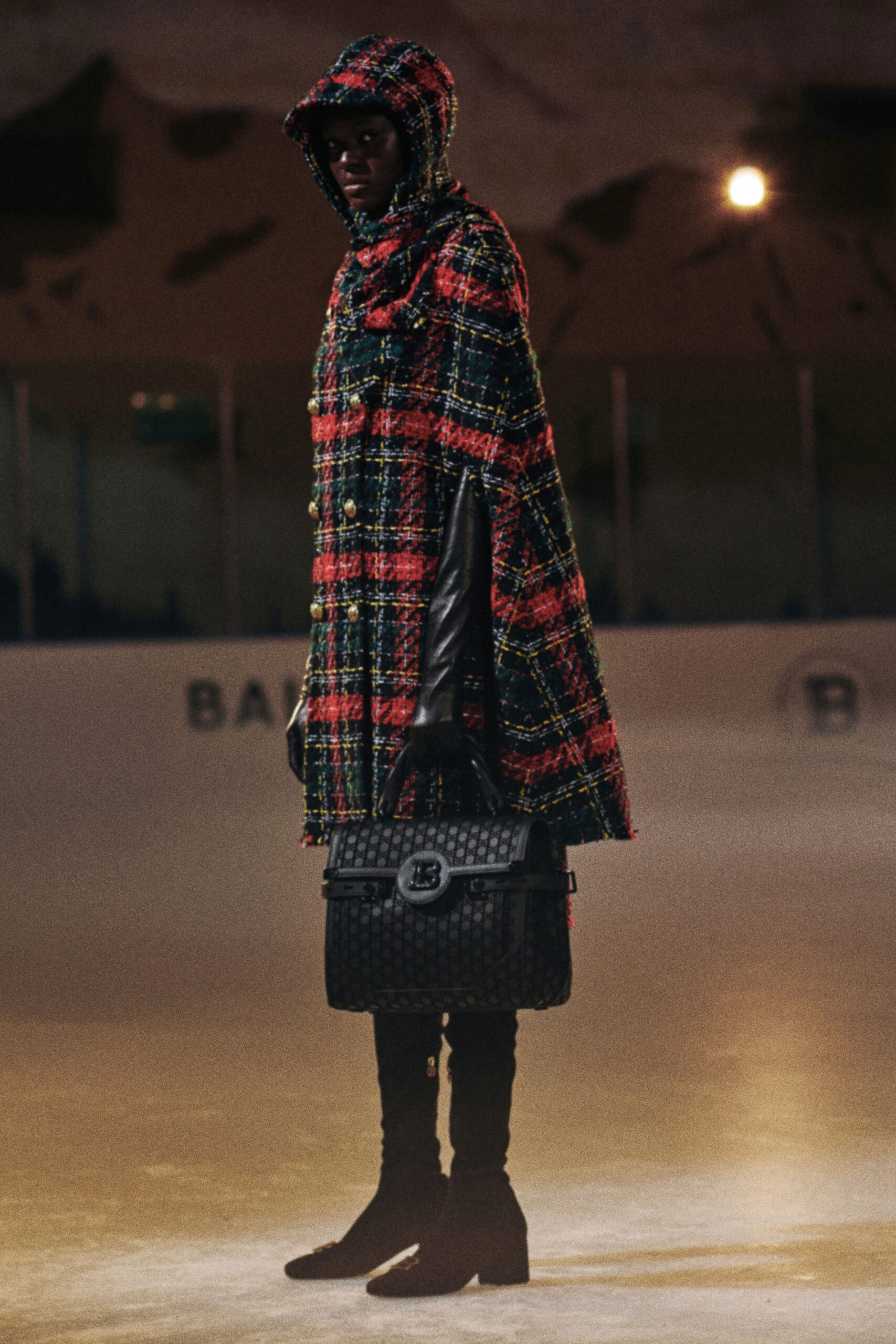 checked wool cape with leather boots