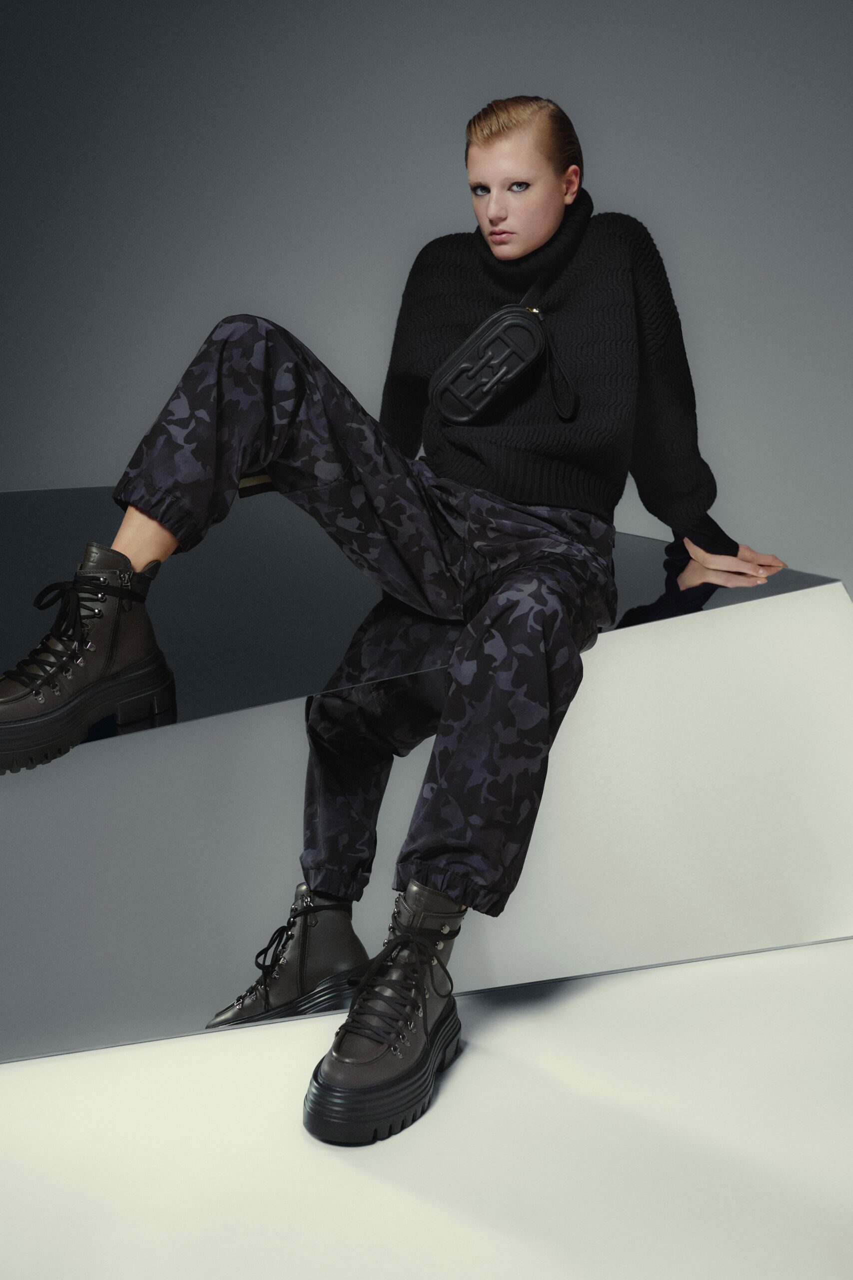 black relaxed sweater and cargo pants