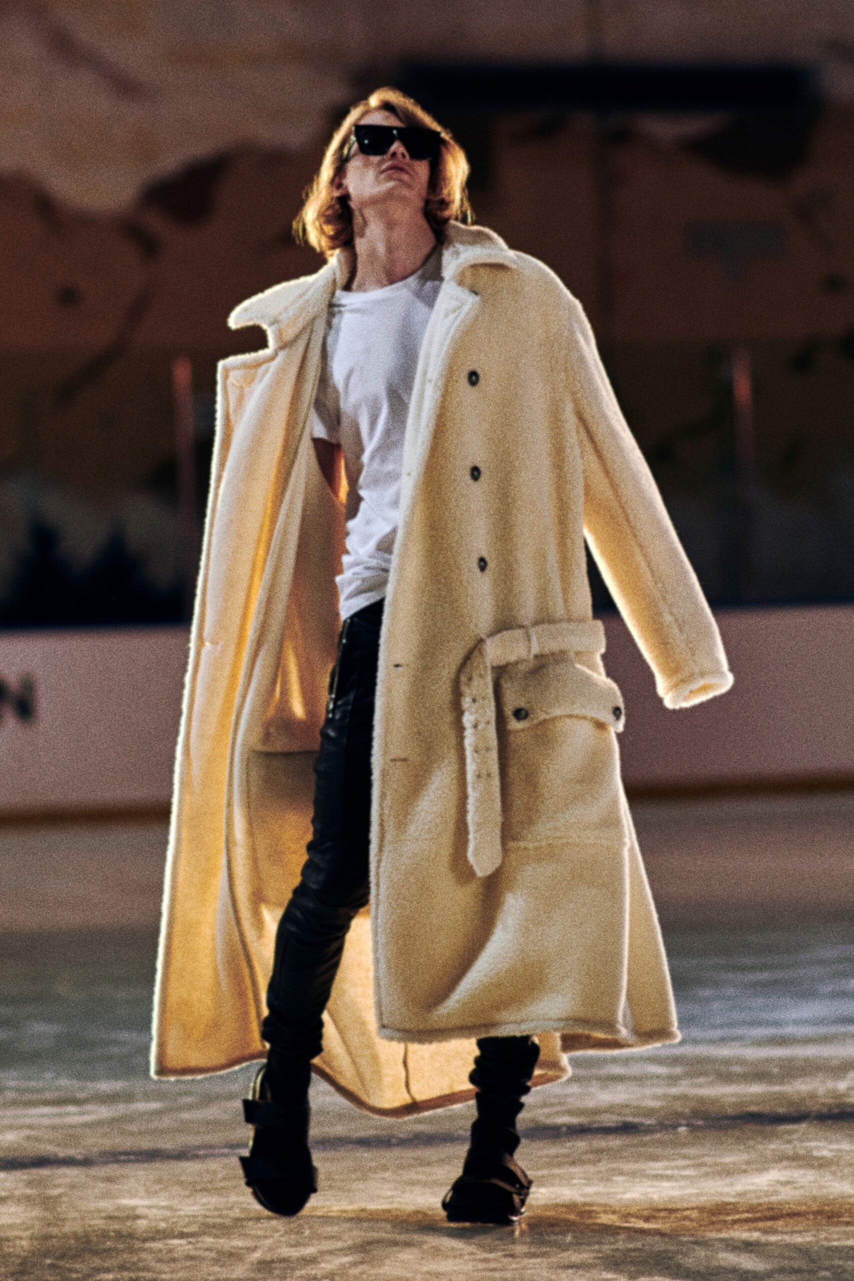 white faux-fur coat with black leather pants