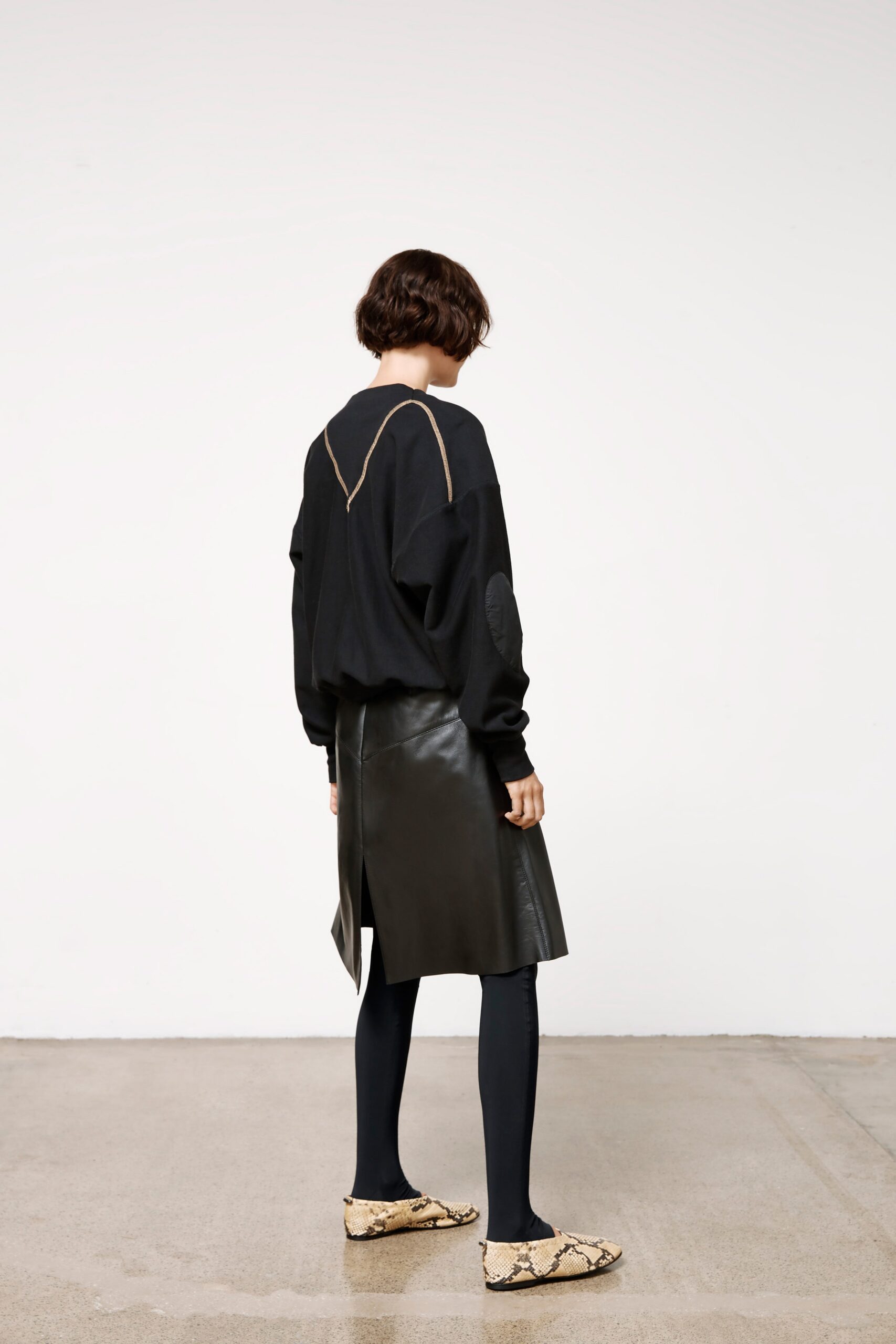 black cotton long-sleeve collared relaxed draped top