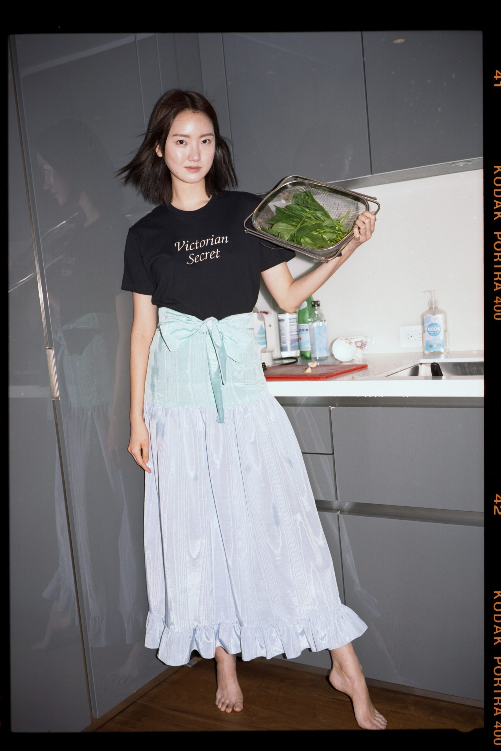 black cotton fitted top and light blue tiered skirt