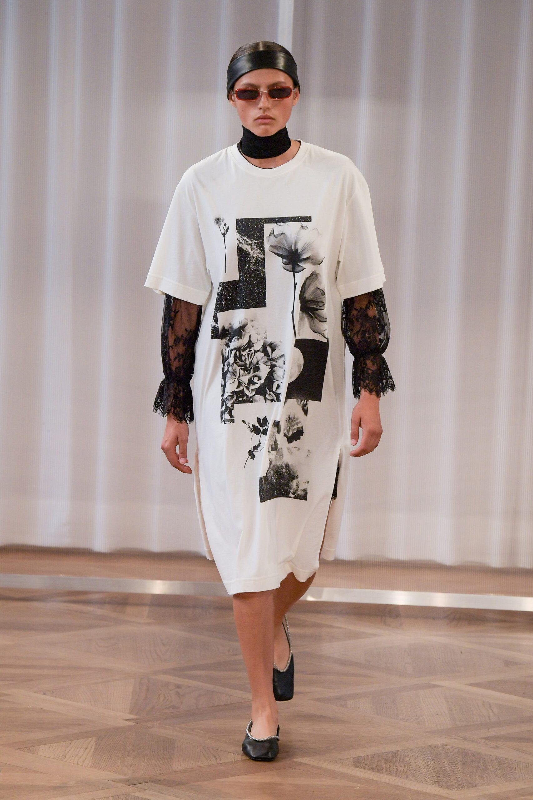 white printed dress with black lace blouse