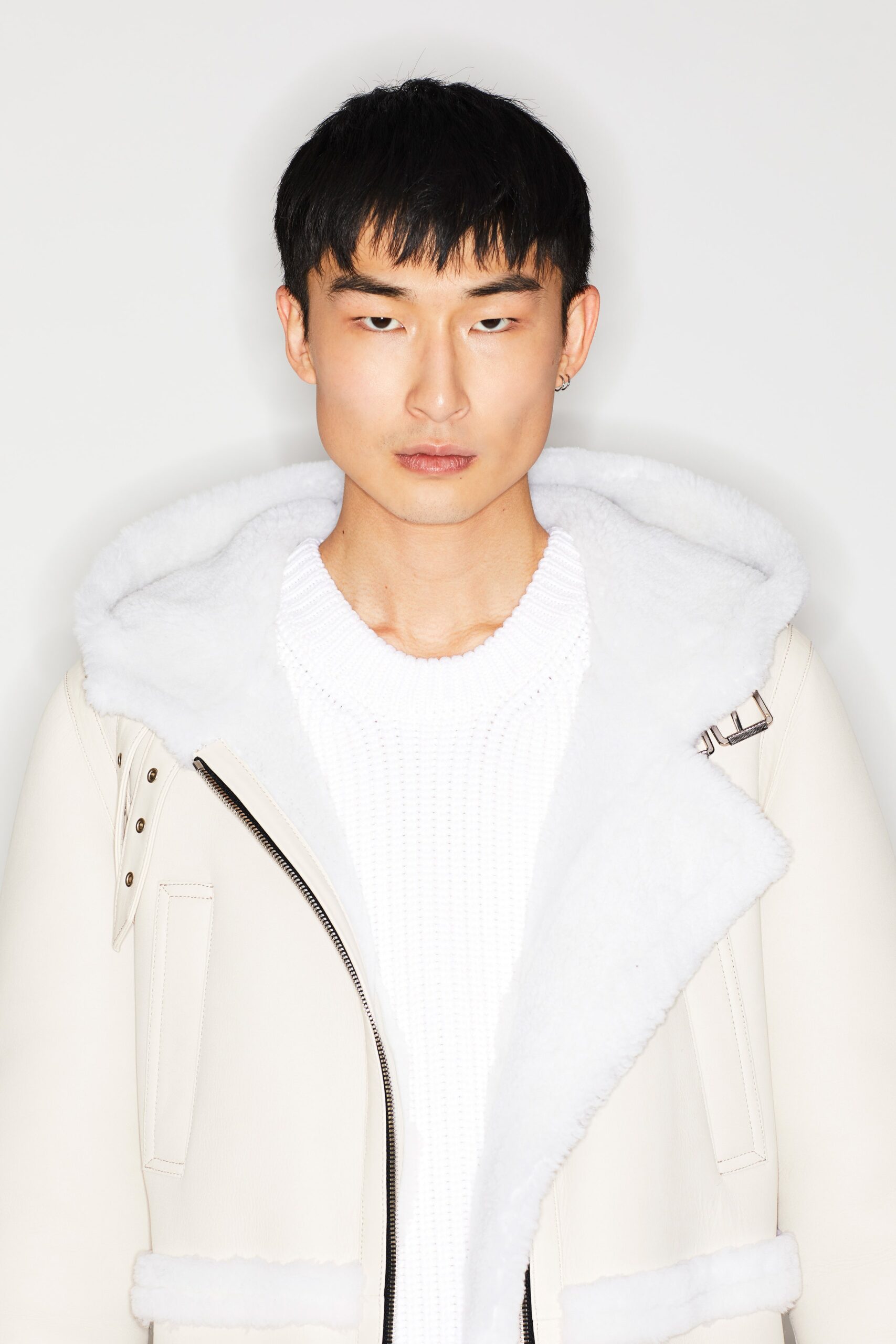 white leather jacket and sweater