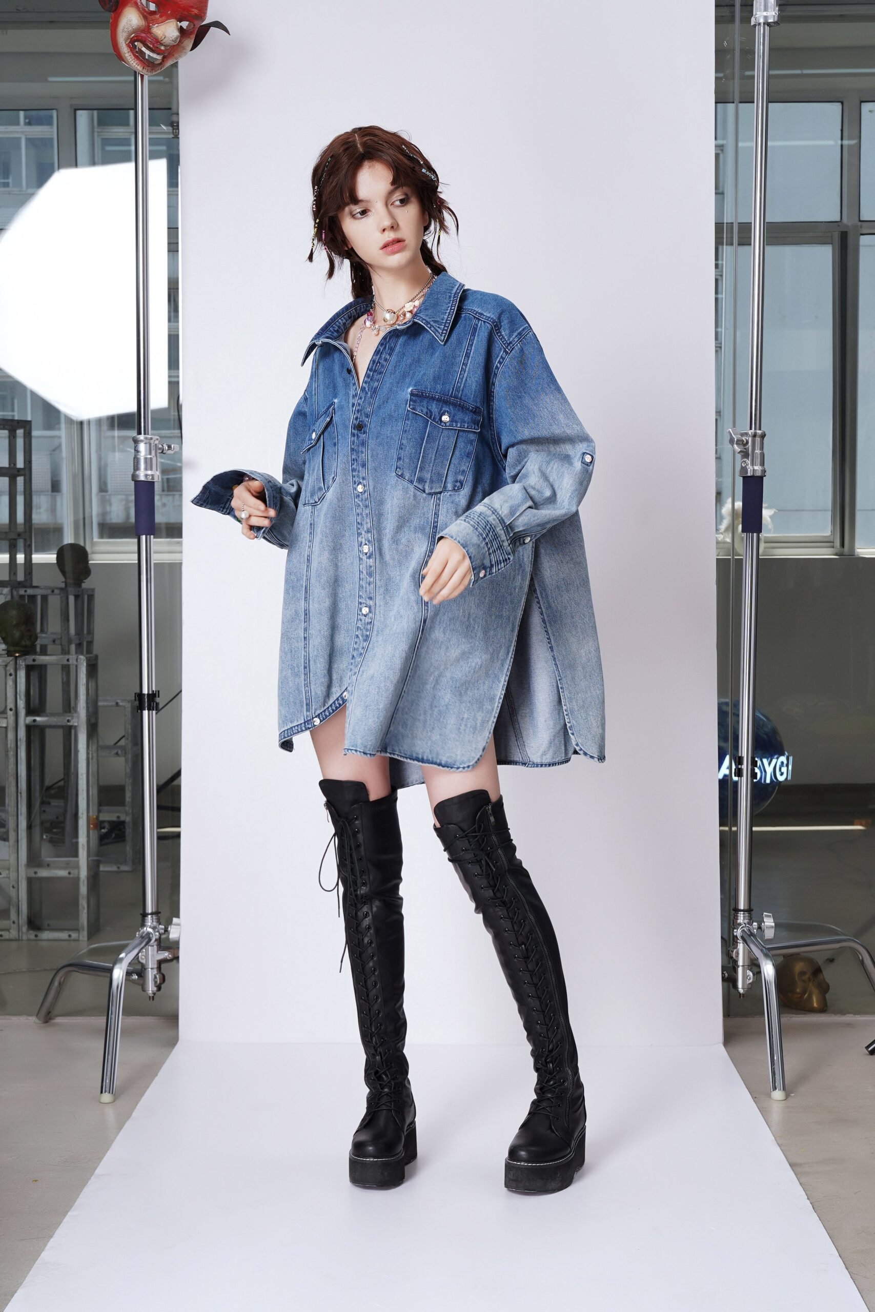 oversized denim shirt-dress with black boots