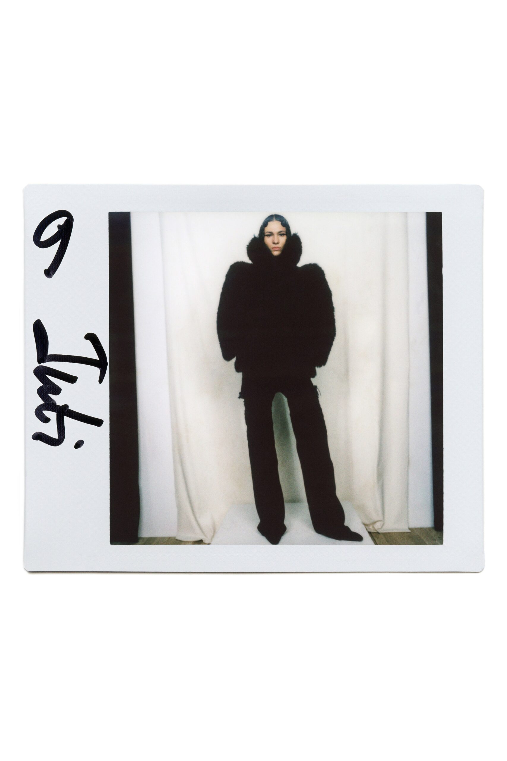 black fur long-sleeve collared oversized layered coat