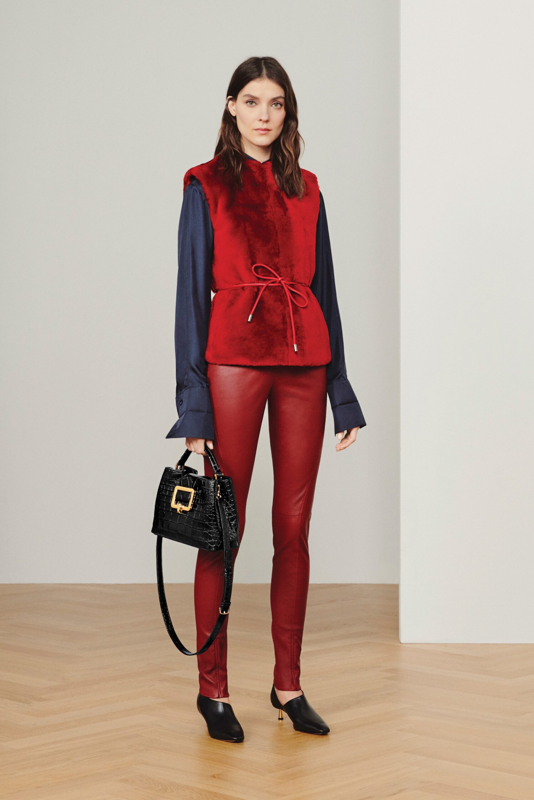 red faux-fur top with fitted pants