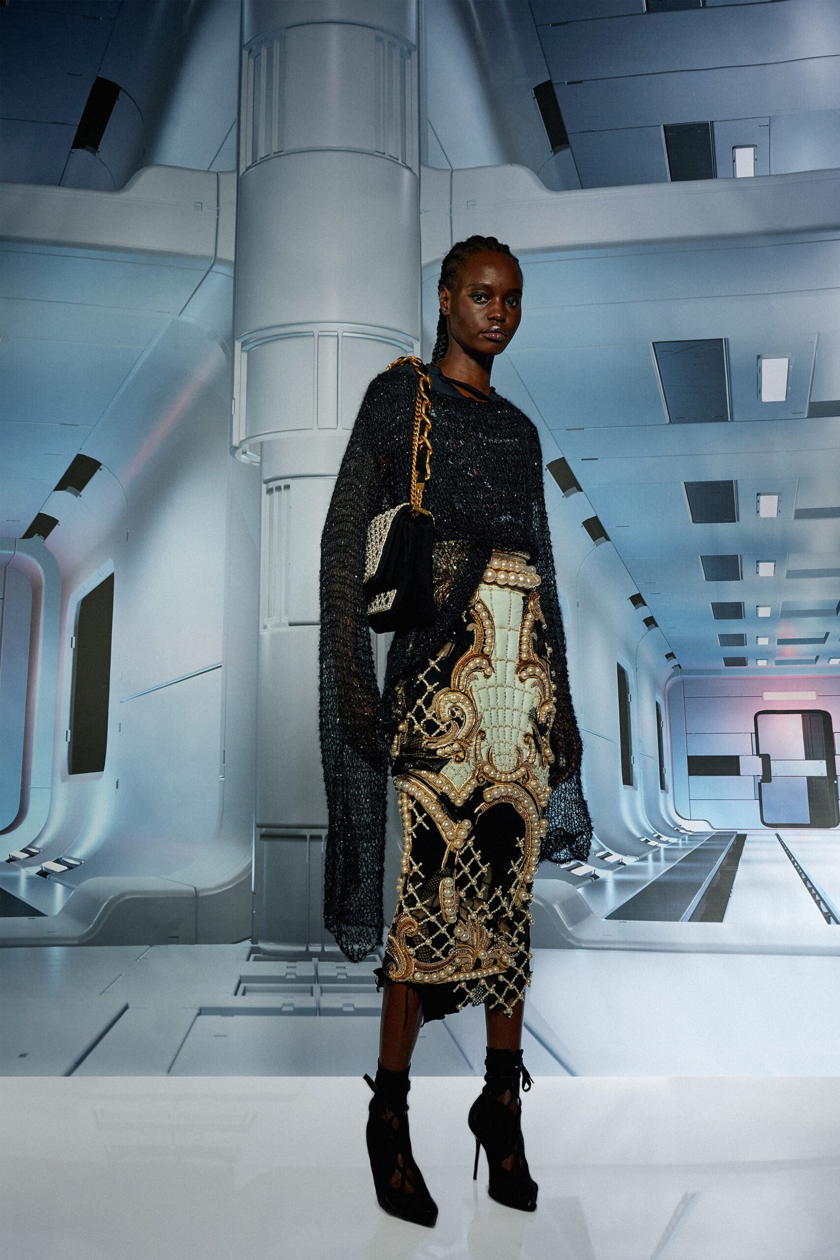 black silk off-shoulder top with gold midi skirt