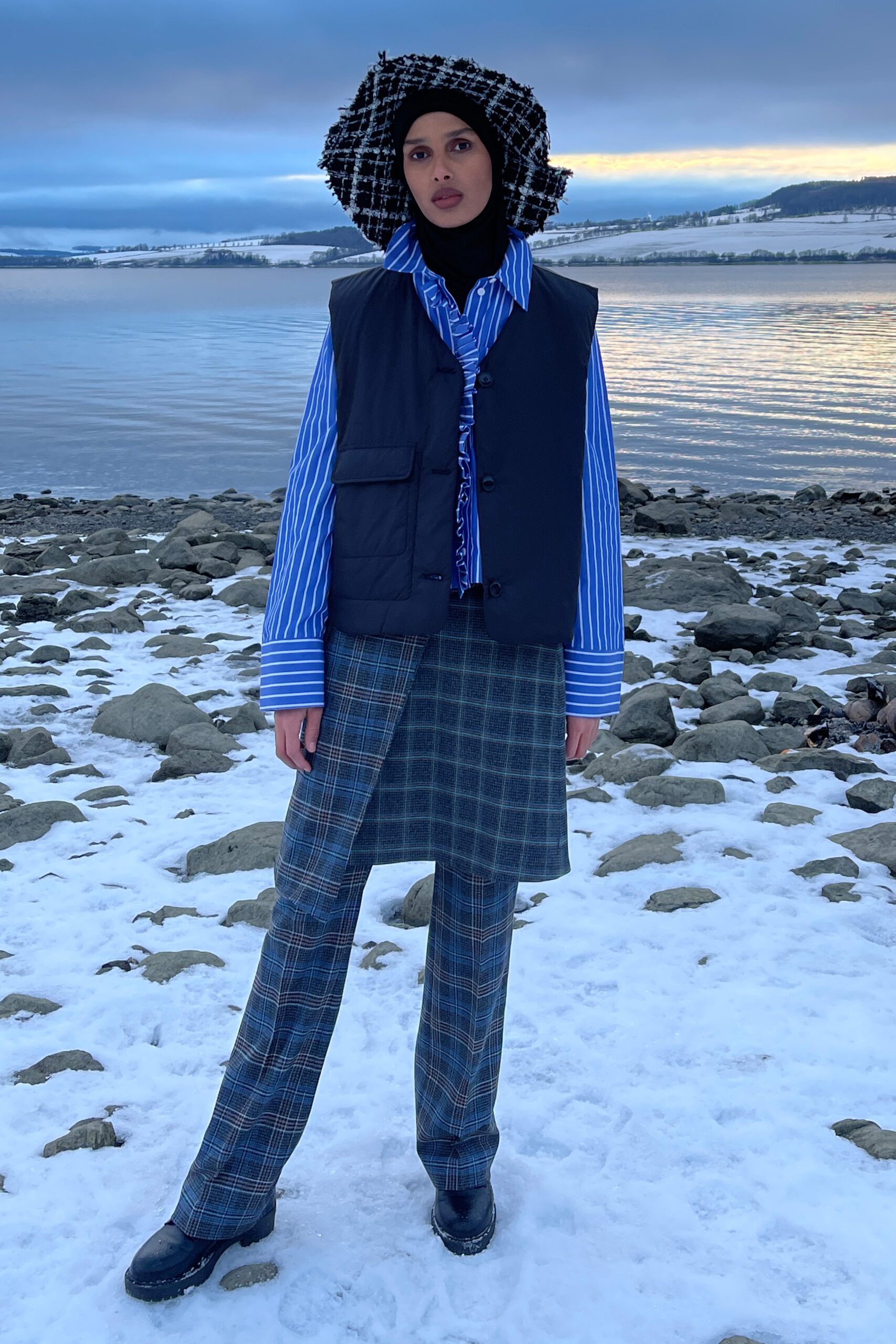 black vest blue striped shirt gray checked pants