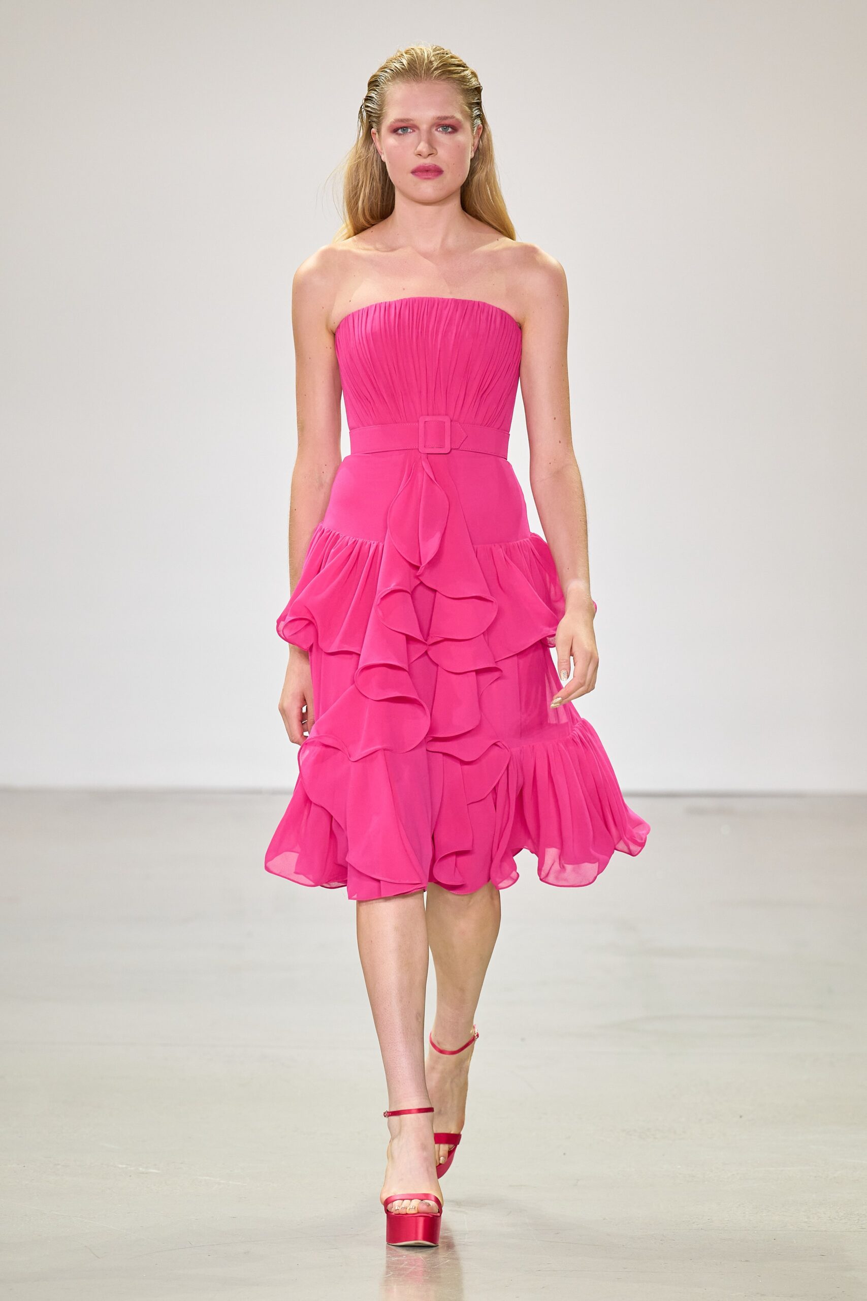 pink chiffon strapless fitted ruffled tiered flowing dress