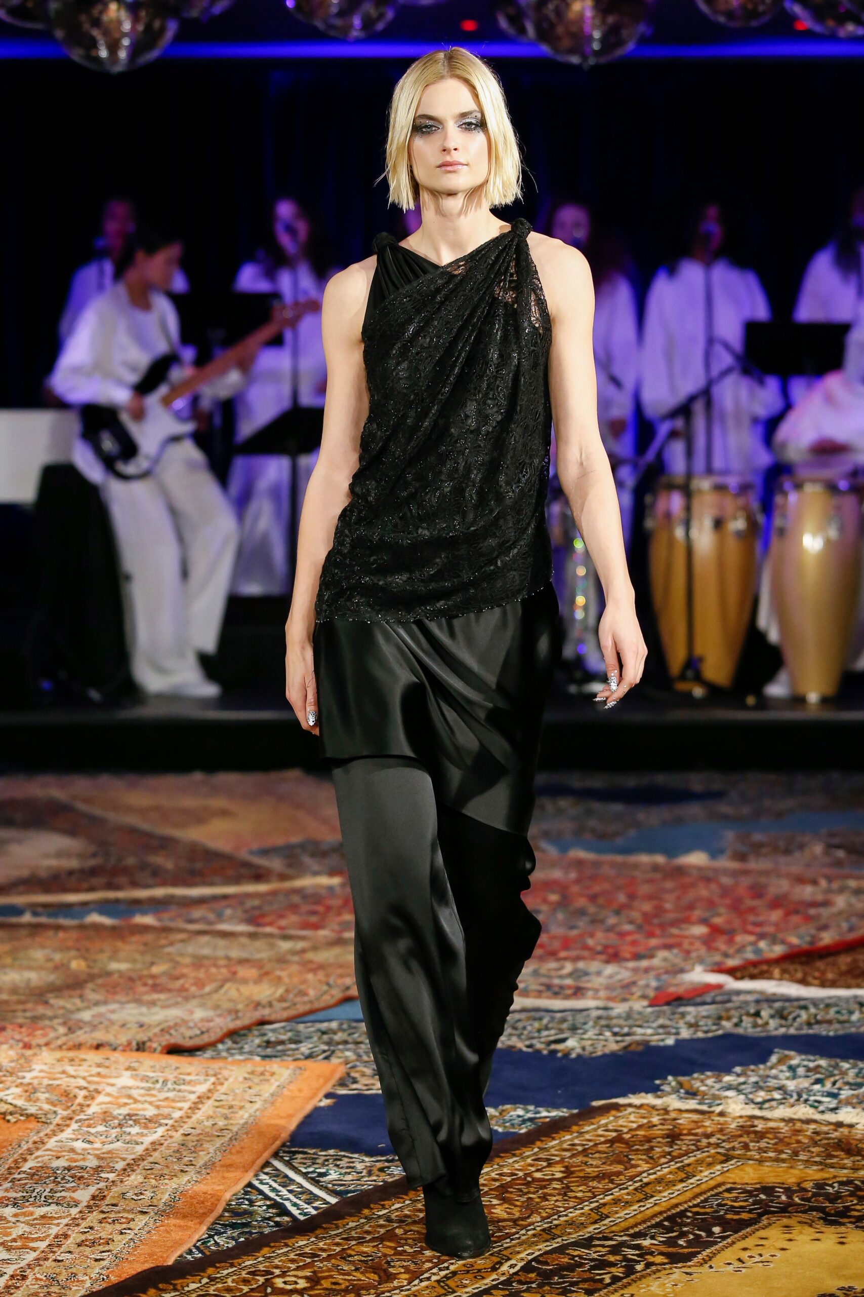 black silk fitted top and relaxed pants