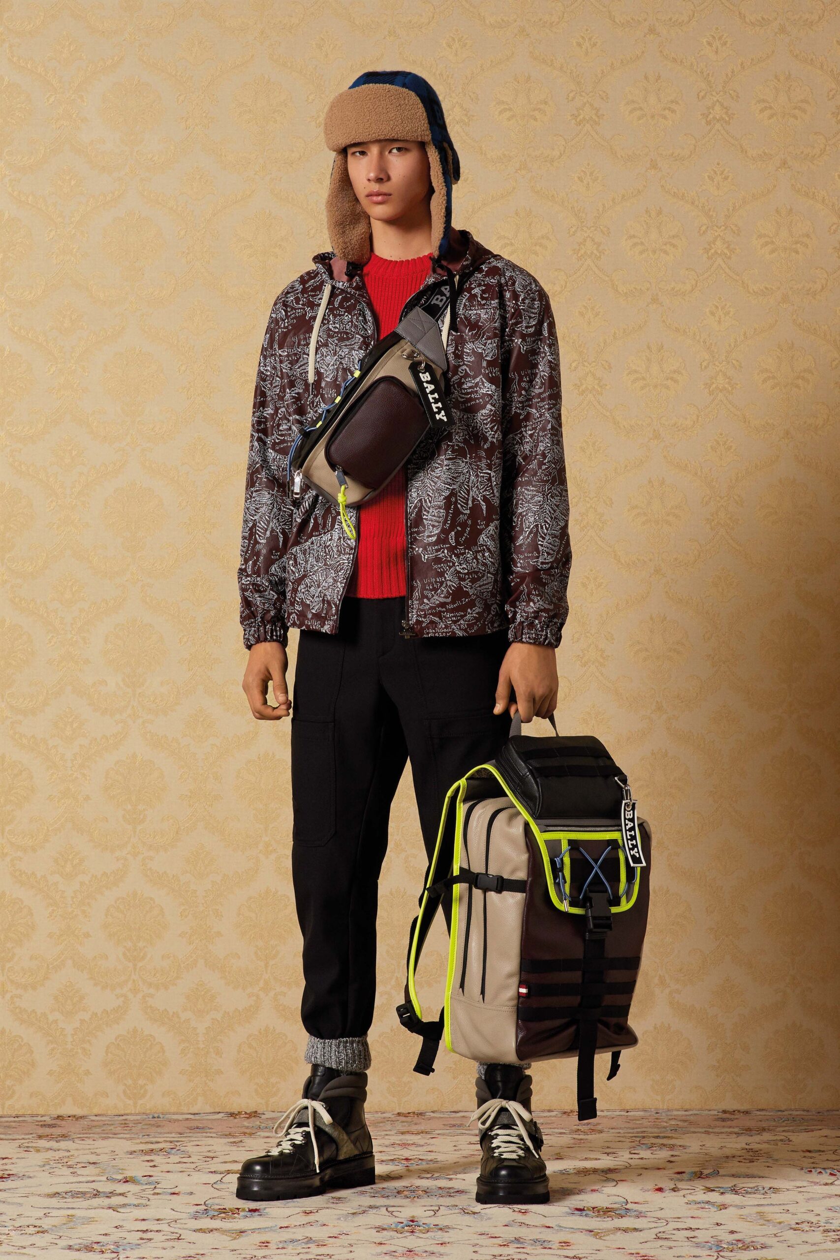 brown printed jacket with red sweater