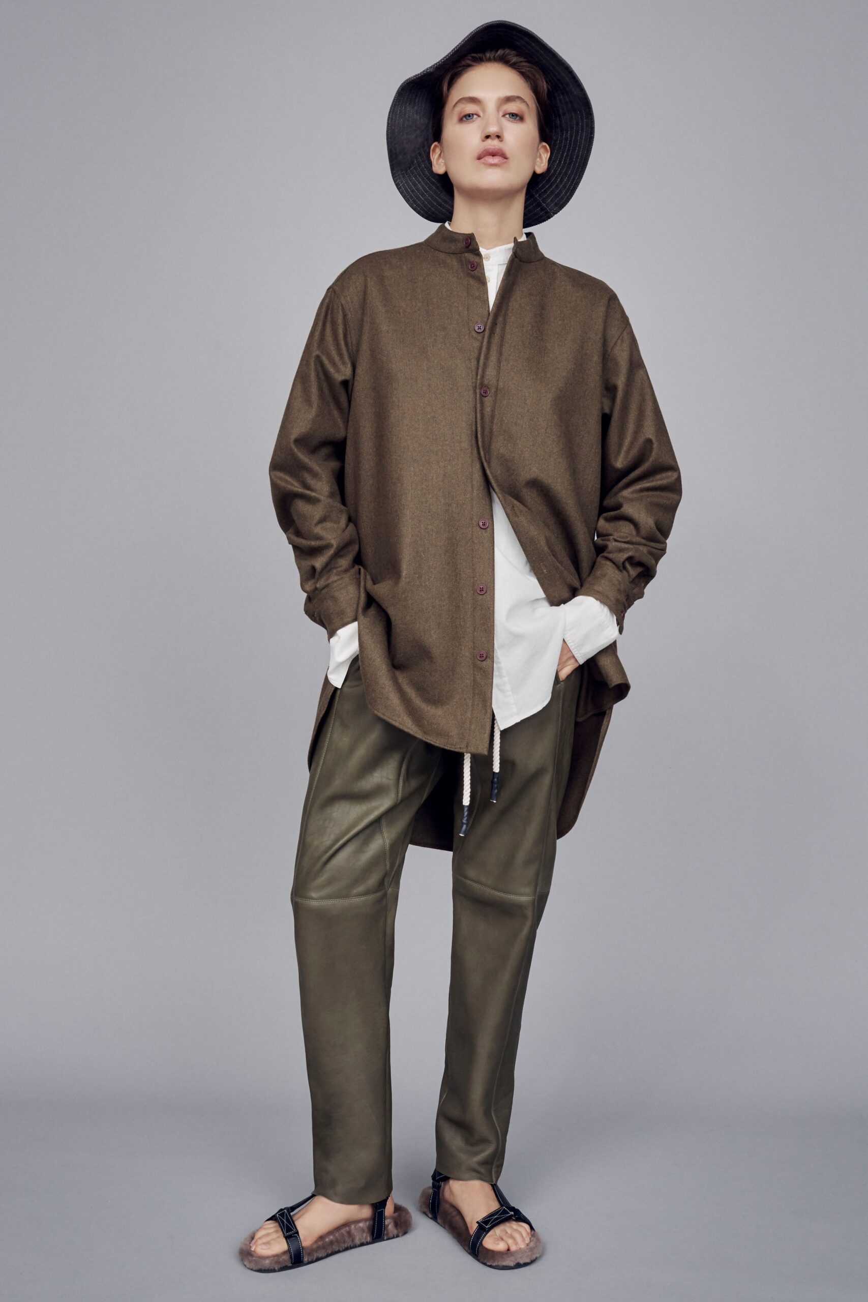 brown relaxed shirt with green pants