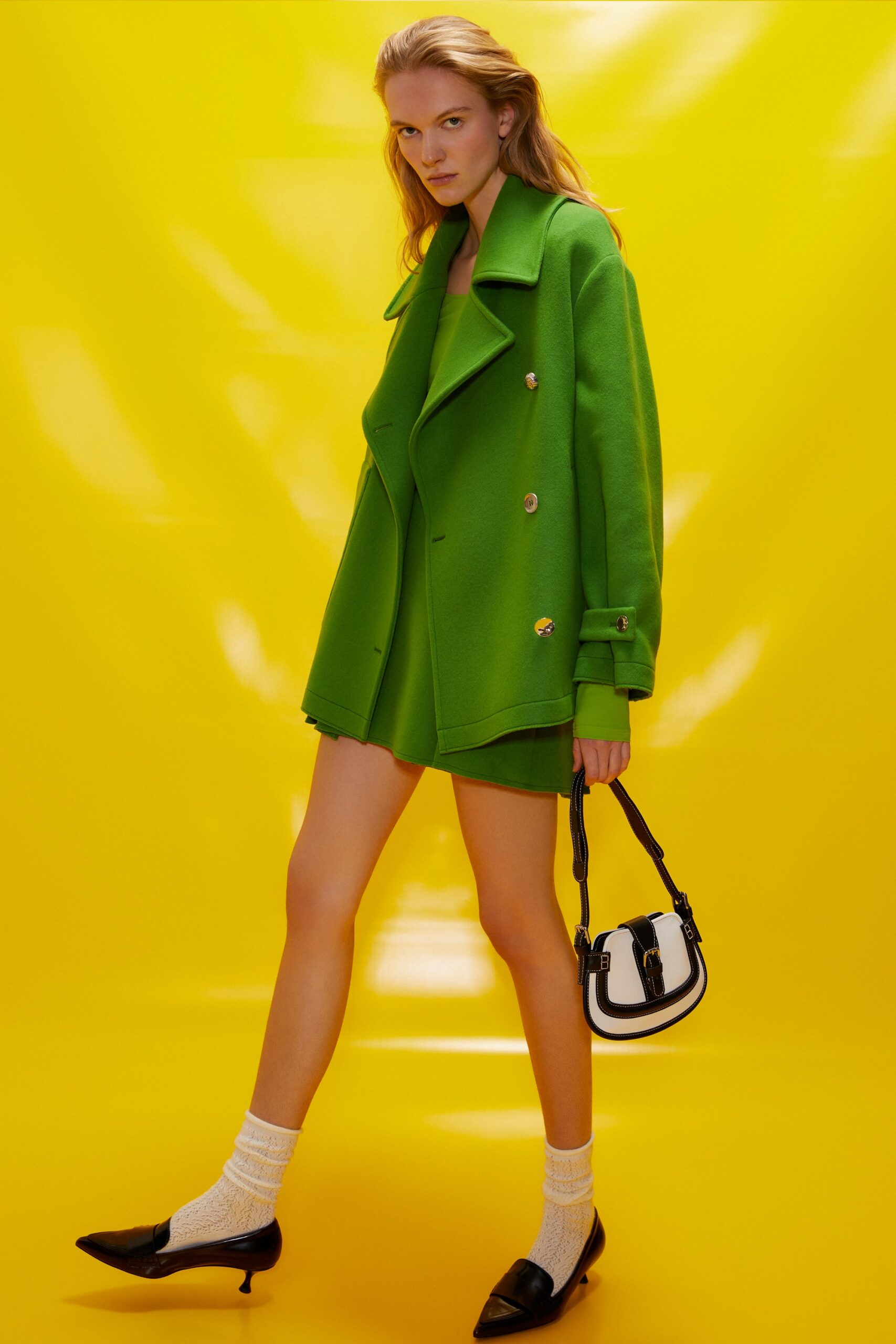 green oversized coat with mini dress