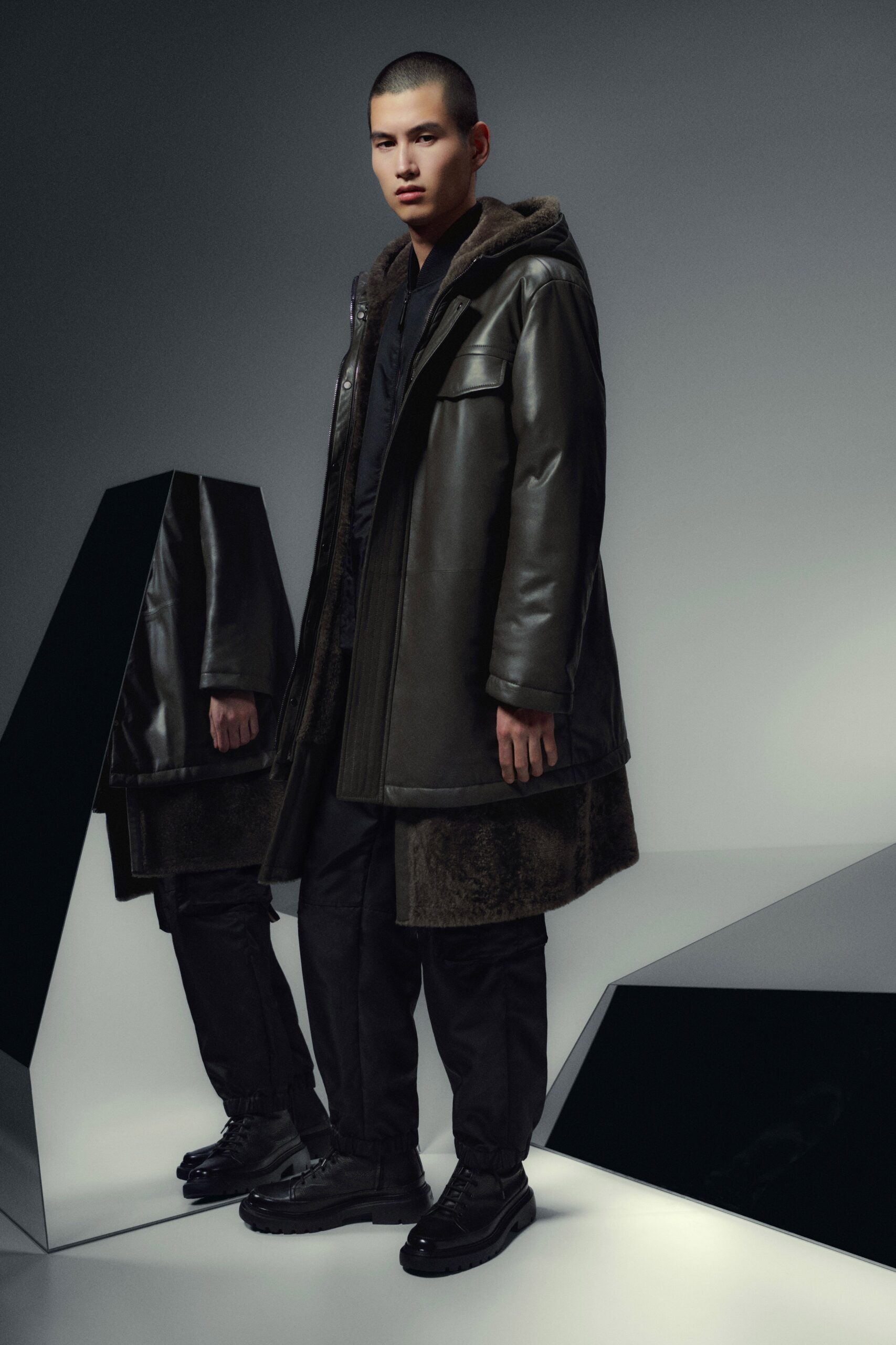black leather coat with relaxed pants