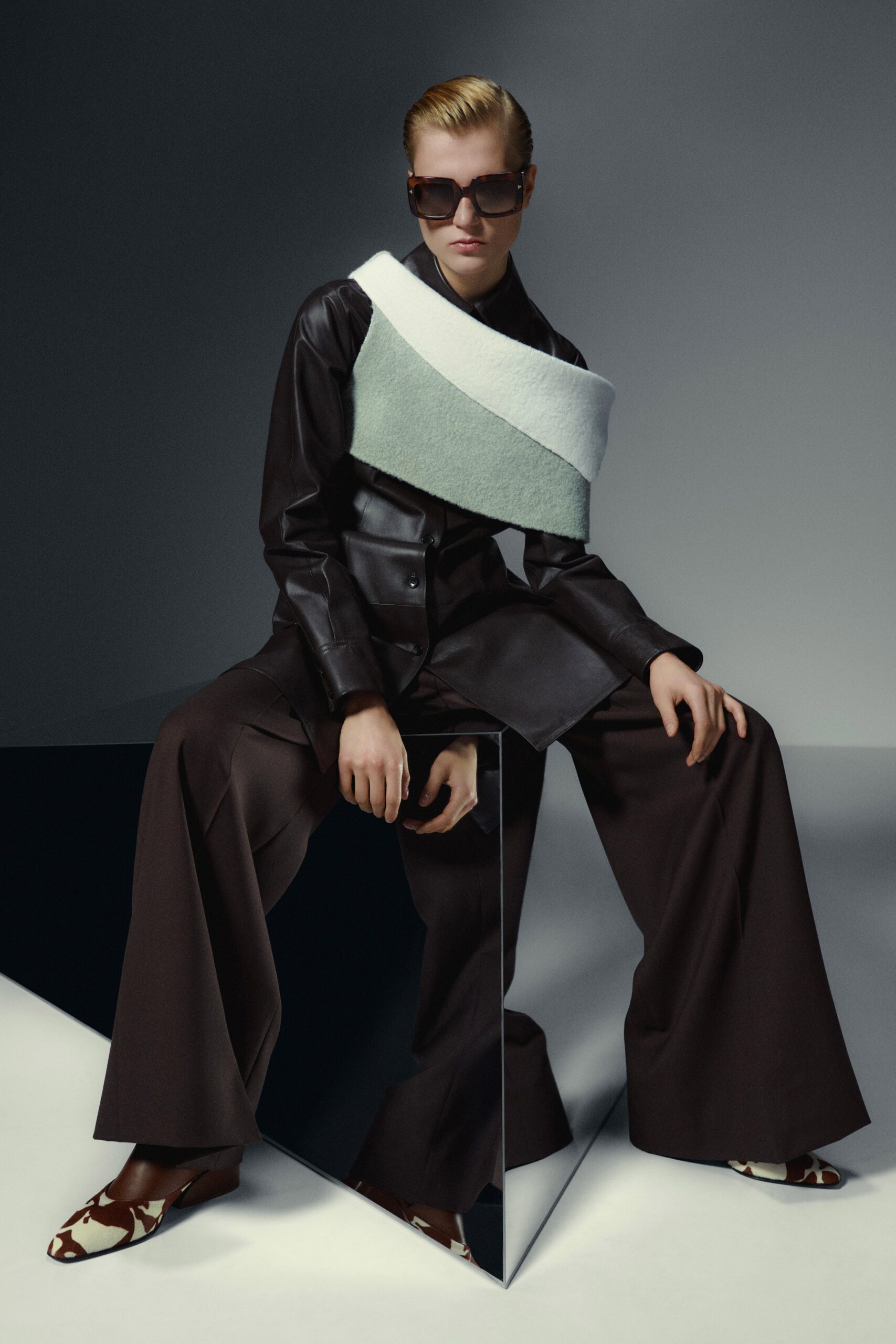 black leather jacket with wide-leg pants