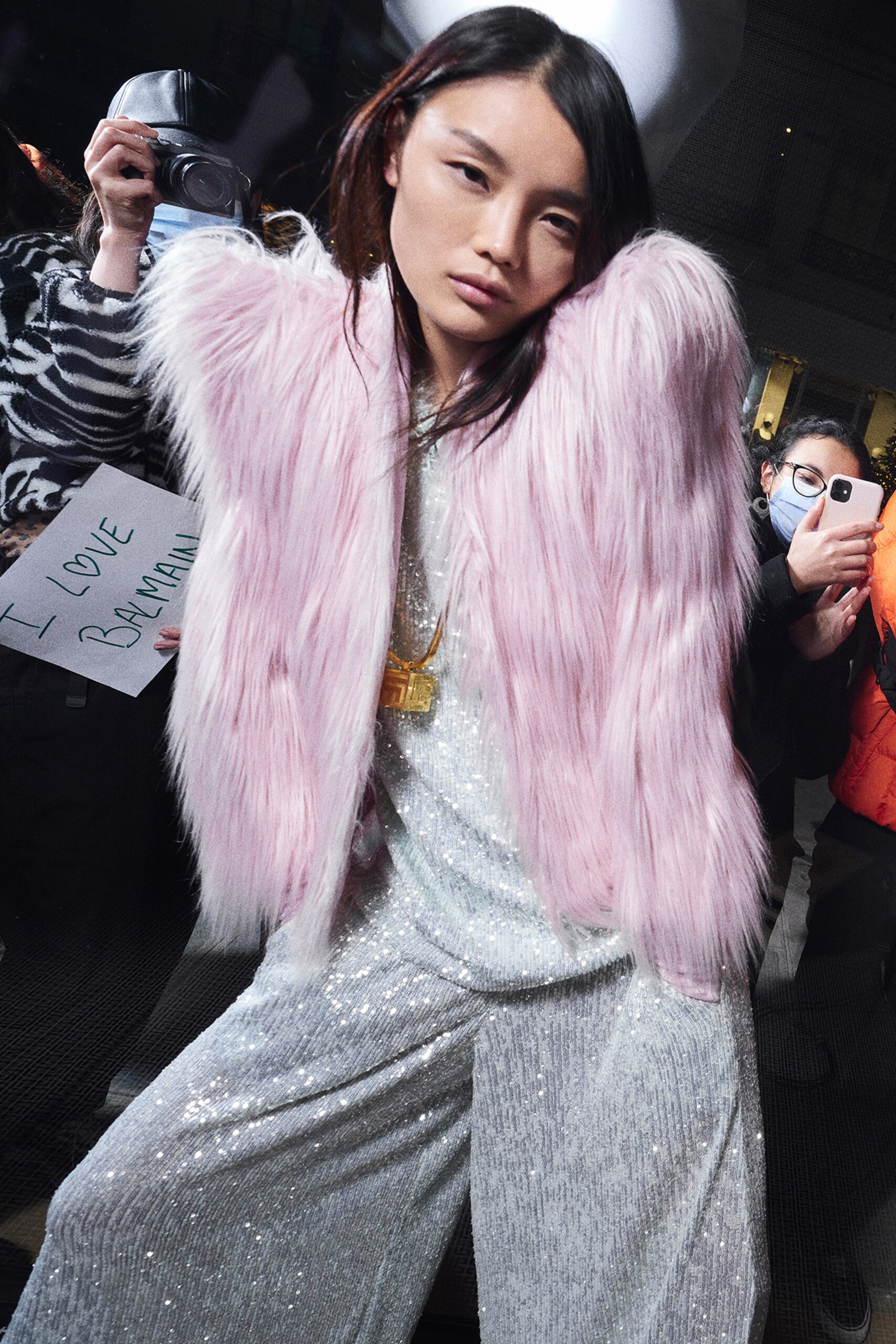 pink faux-fur jacket and silver sequin jumpsuit