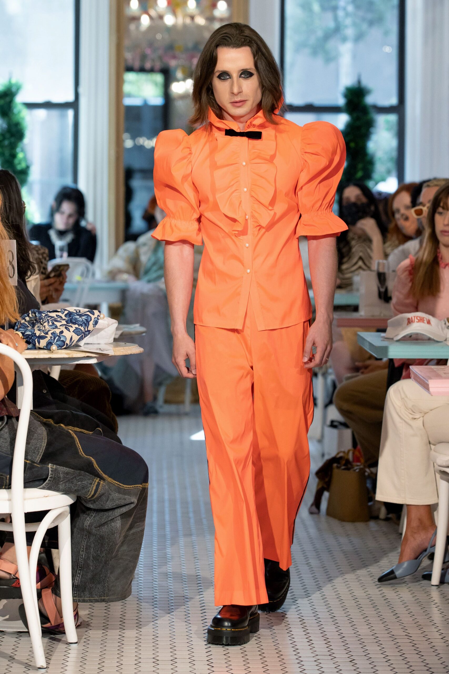 orange fitted suit with pleats