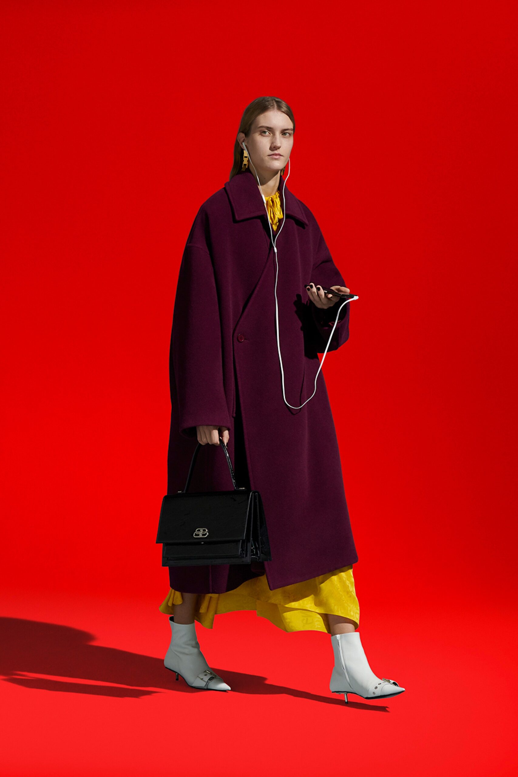 oversized purple coat with yellow dress