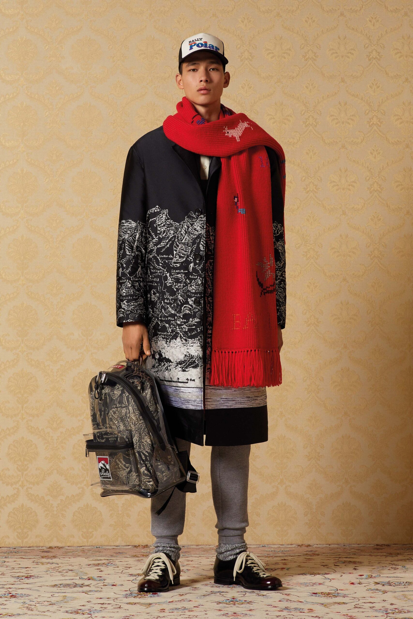 black and white layered coat with red scarf