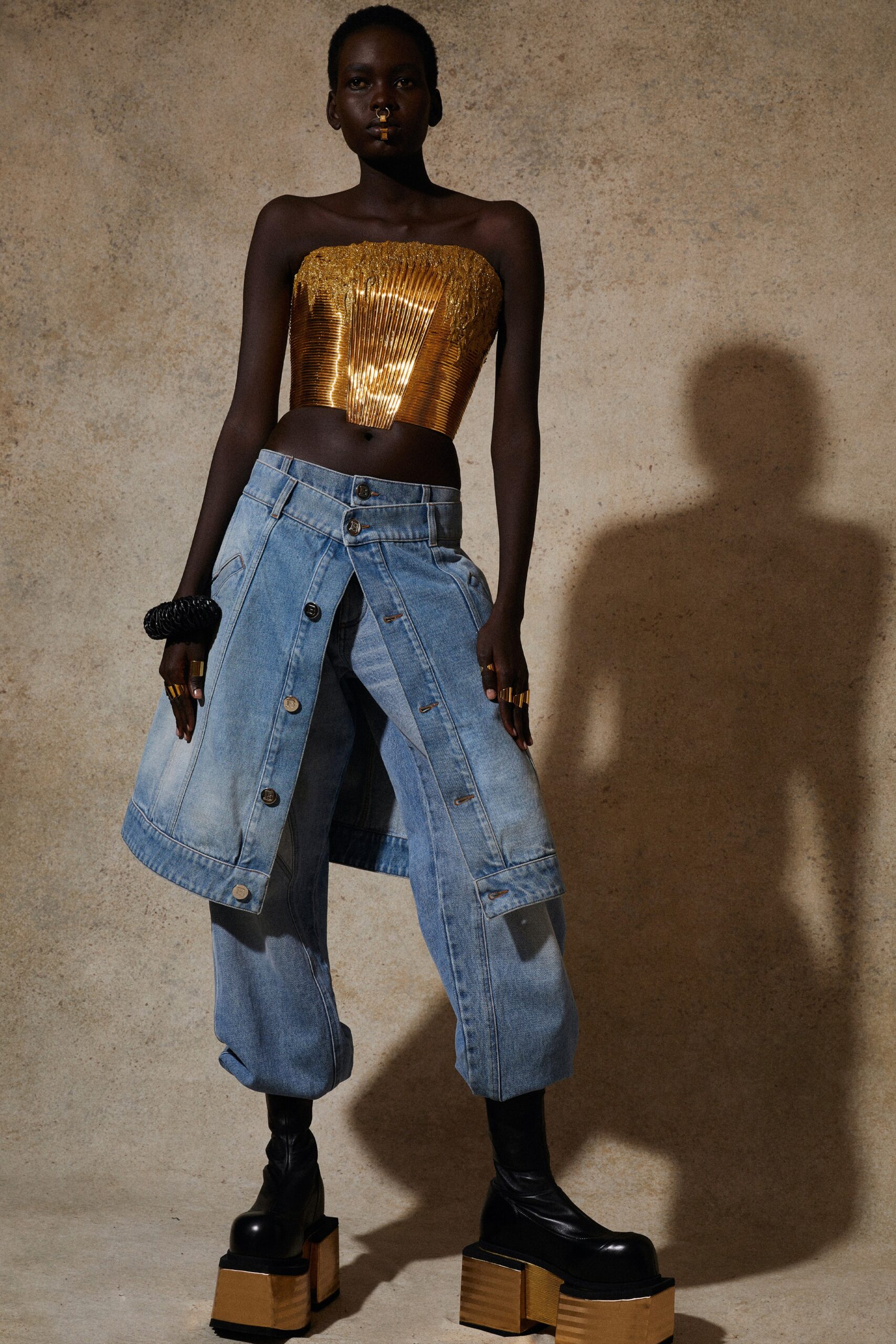 gold pleated strapless top with denim pants
