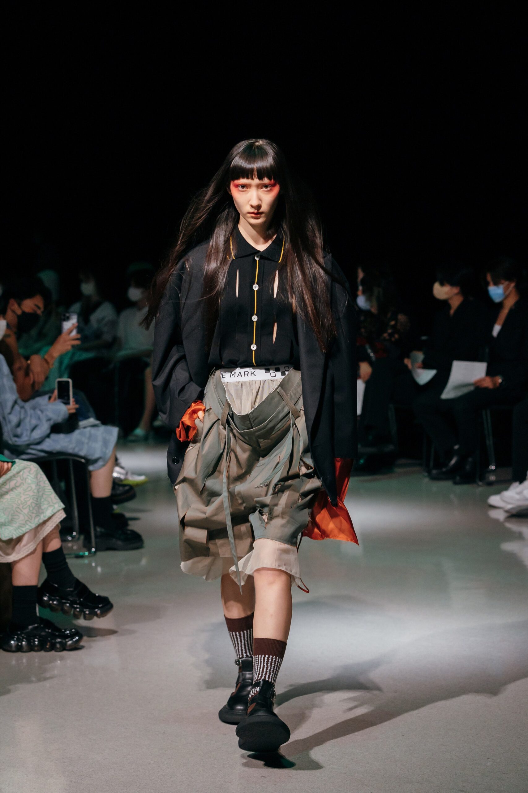 black relaxed jacket with gray cargo shorts