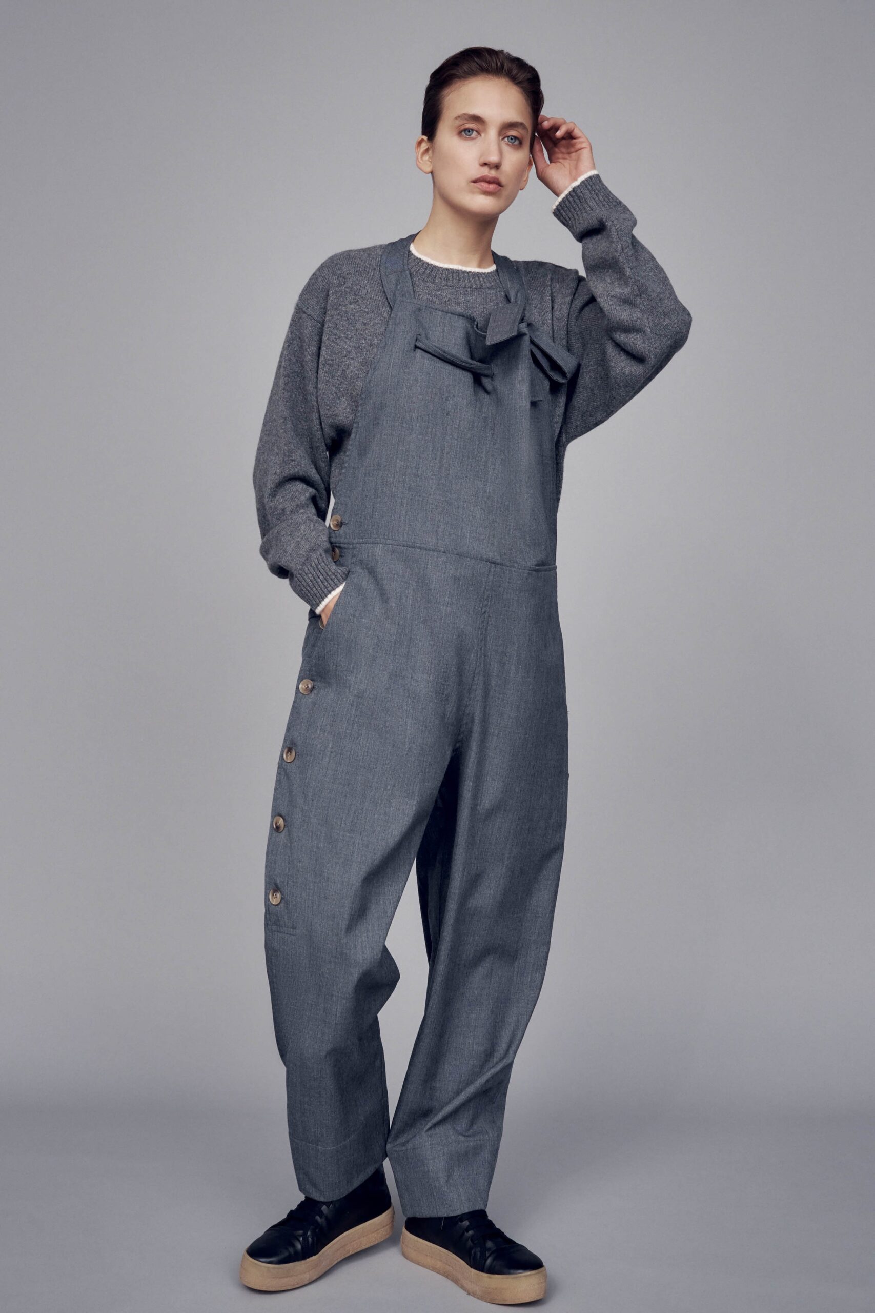 gray relaxed sweater and overalls