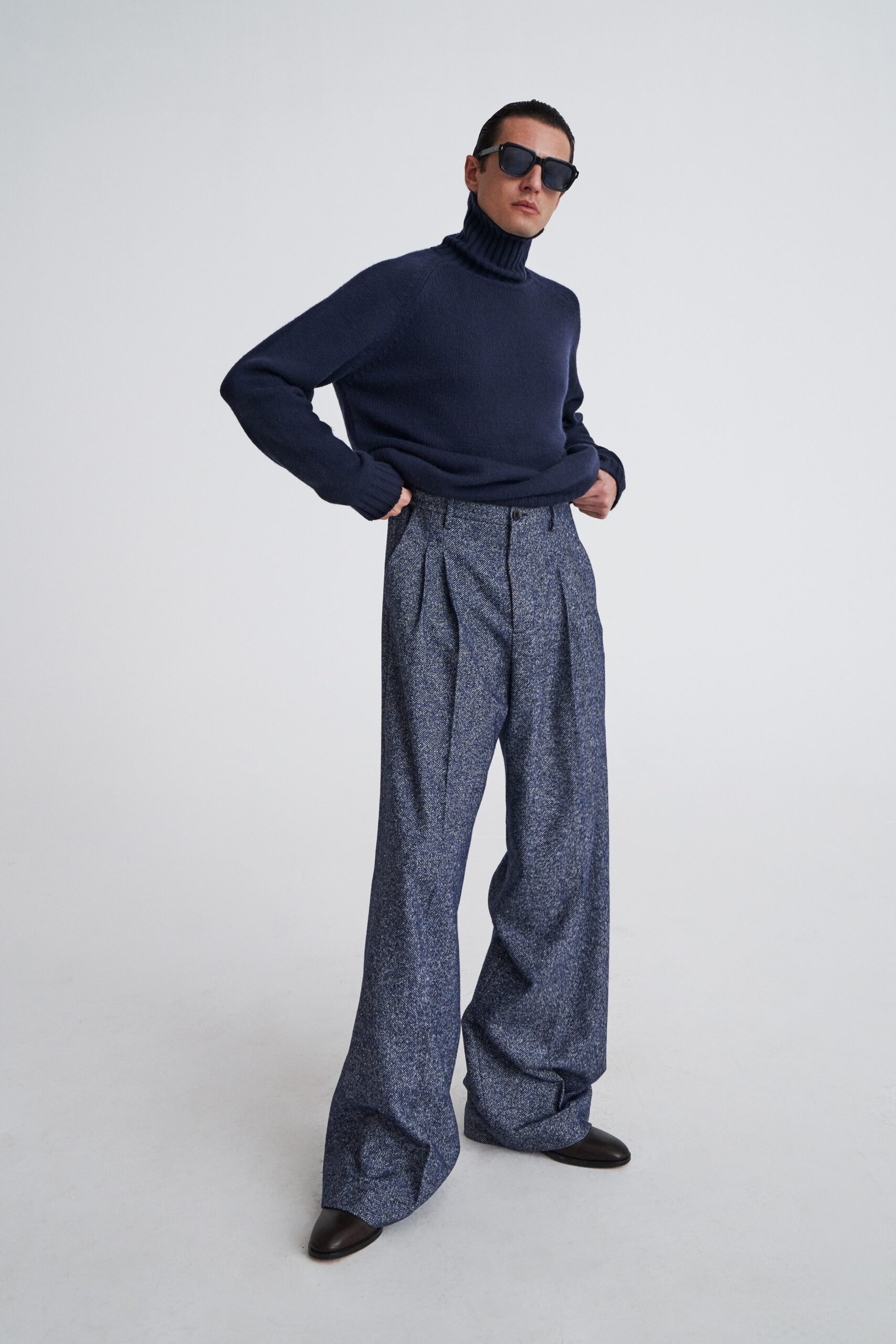 navy wool turtleneck sweater with blue pants