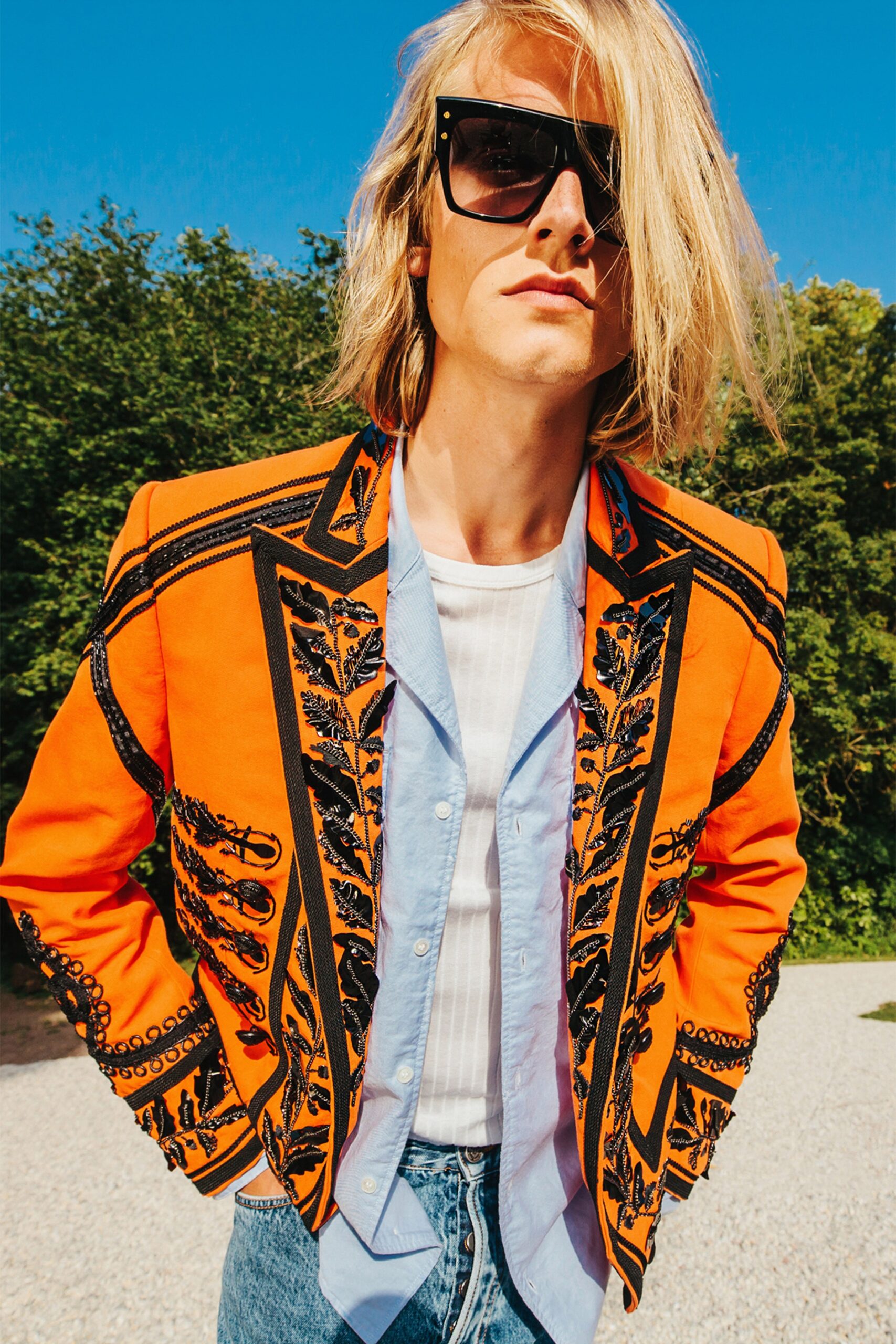 orange embroidered jacket with jeans