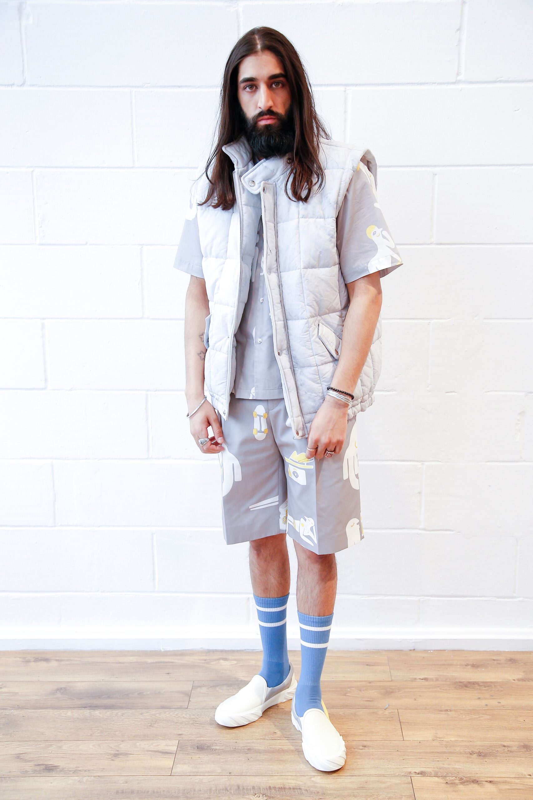 gray relaxed vest and shirt outfit