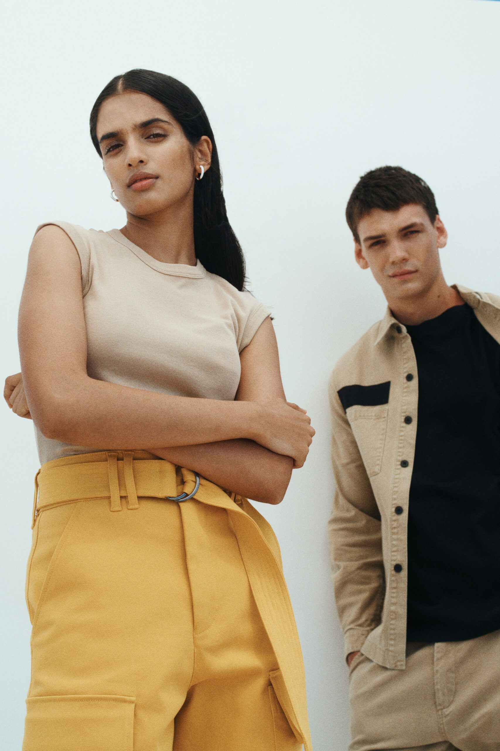 beige fitted top and yellow relaxed pants