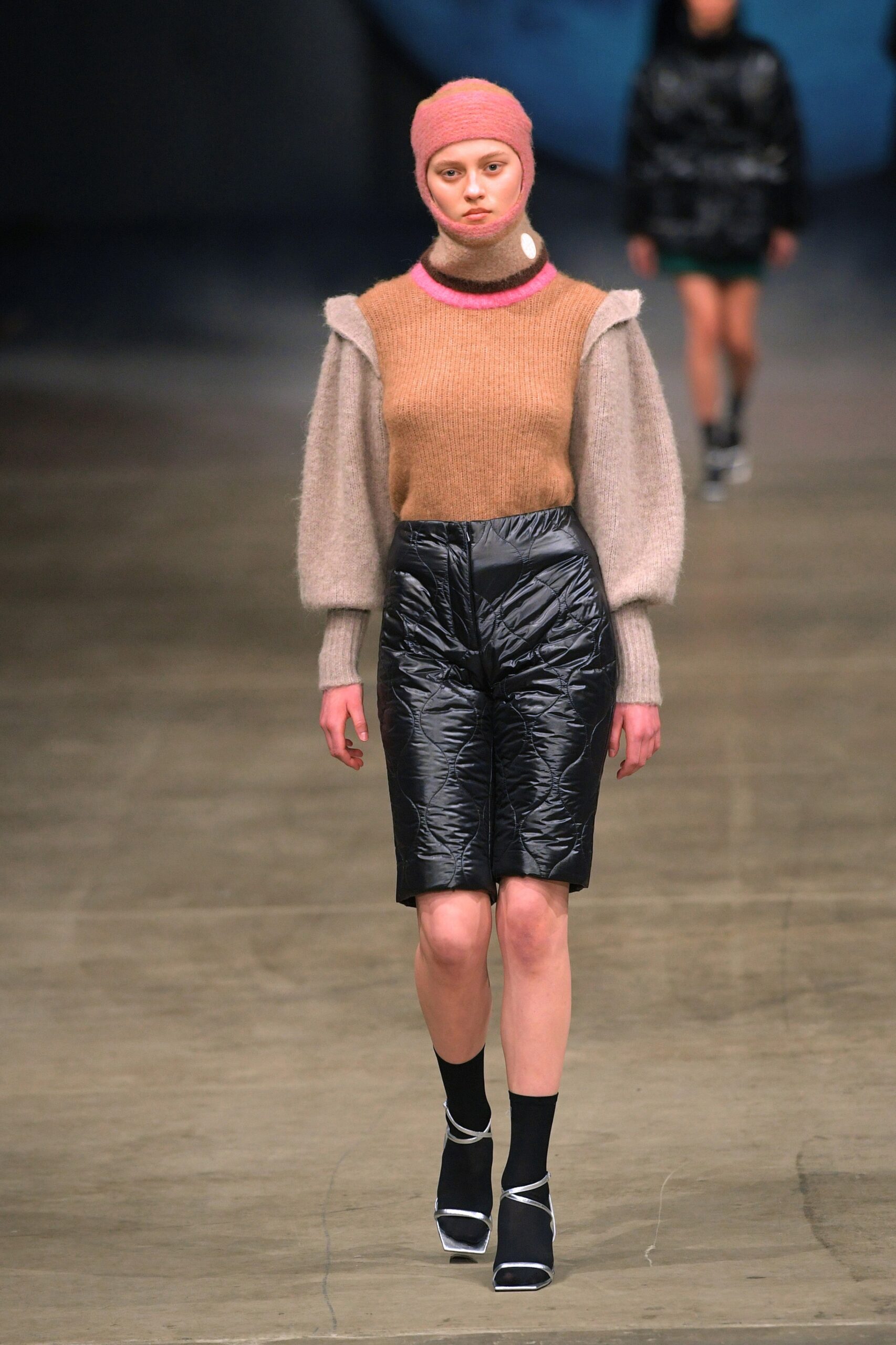 beige and pink fitted top with black shorts