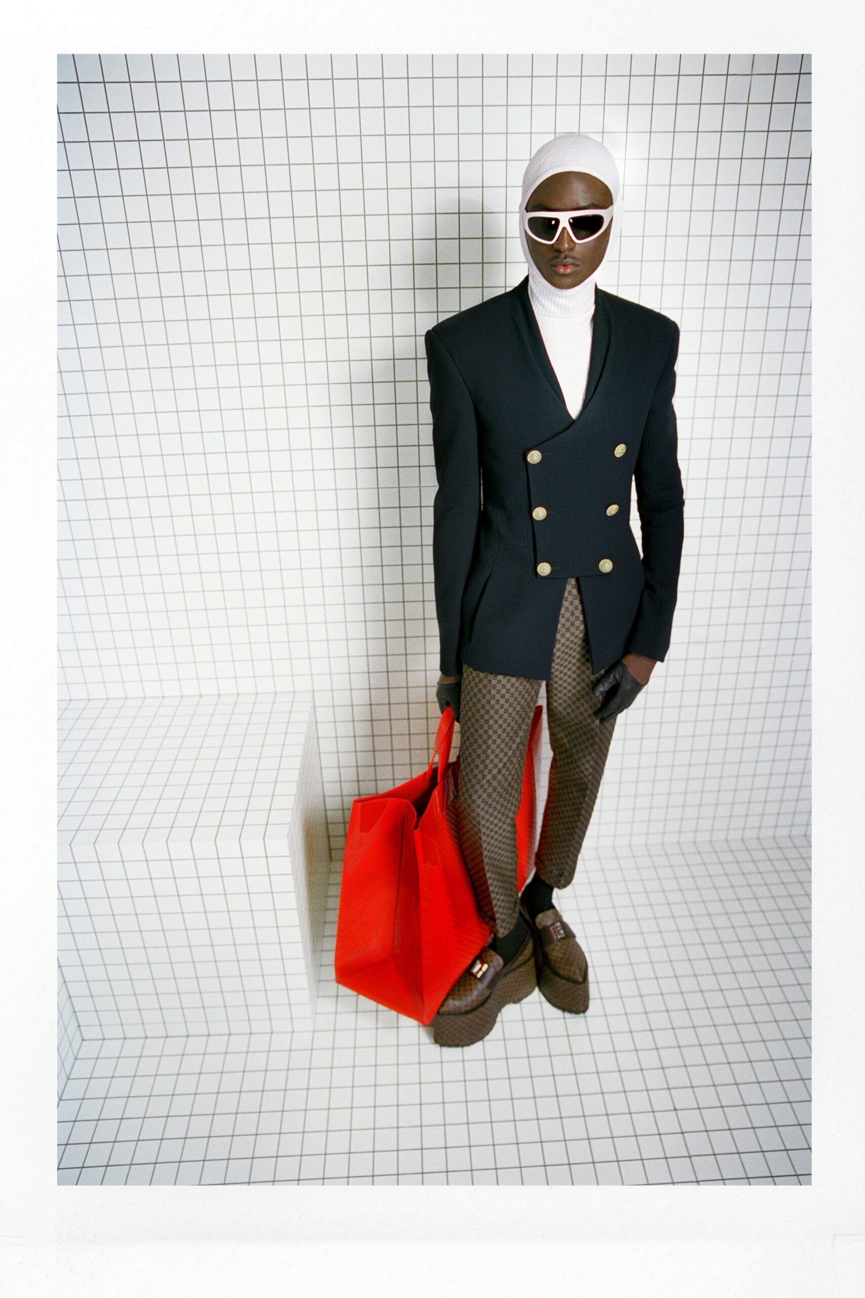 black tailored blazer with brown pants