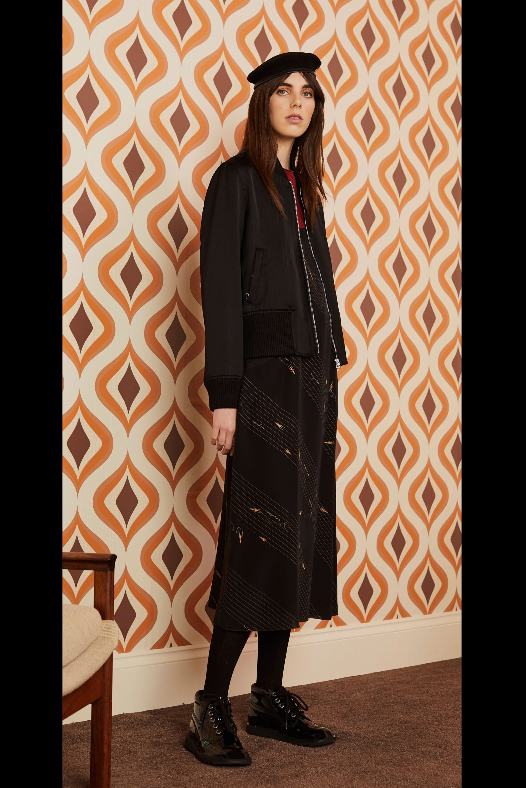 black fitted jacket and midi skirt